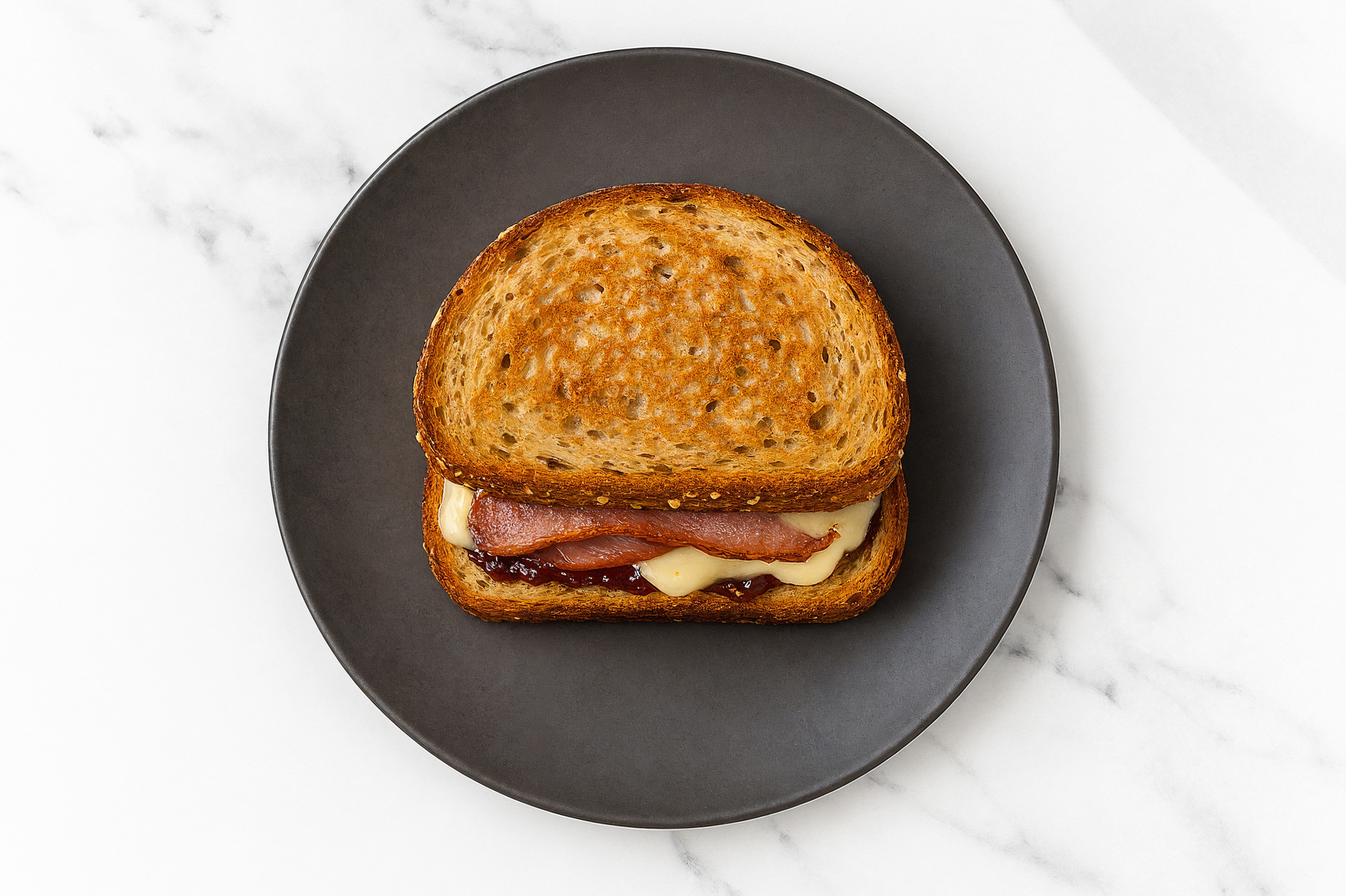 Turkey Bacon, Brie + Strawberry Jam Multgrain Sourdough Grilled Cheese