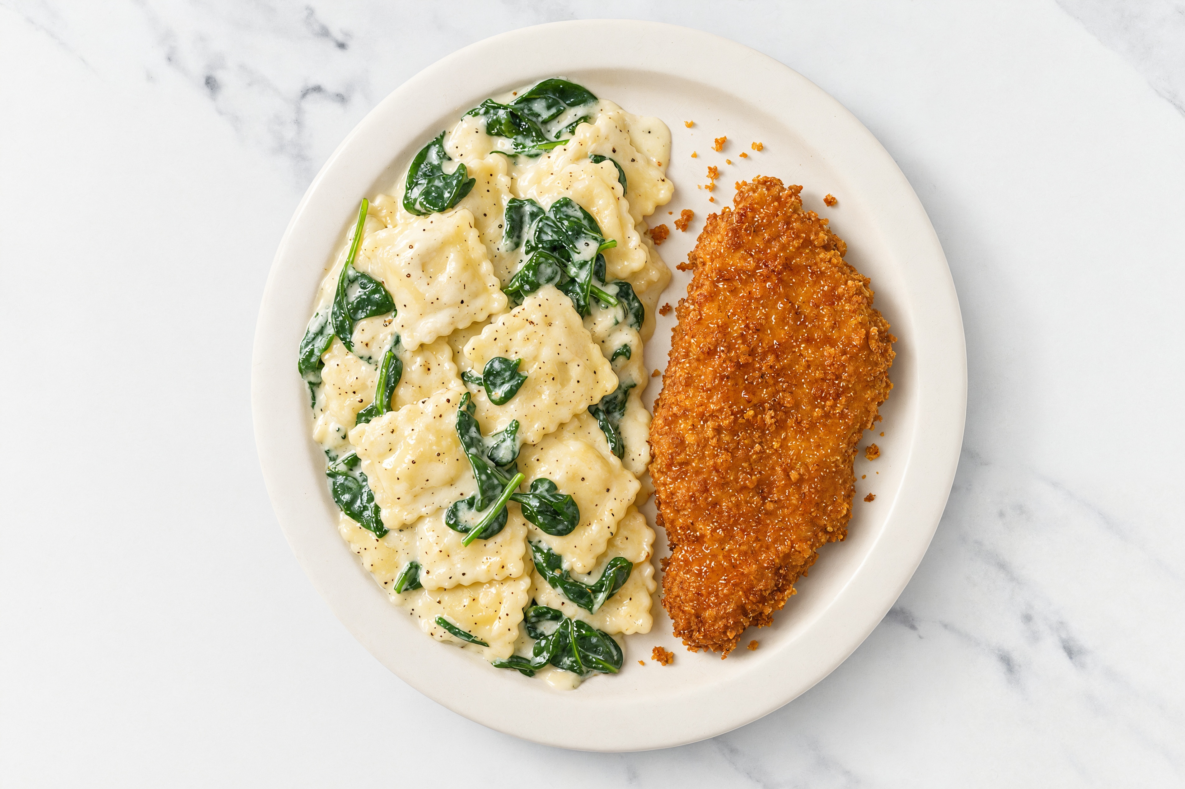 Crispy Hot Honey Chicken over Alfredo Ravioli with Baby Spinach