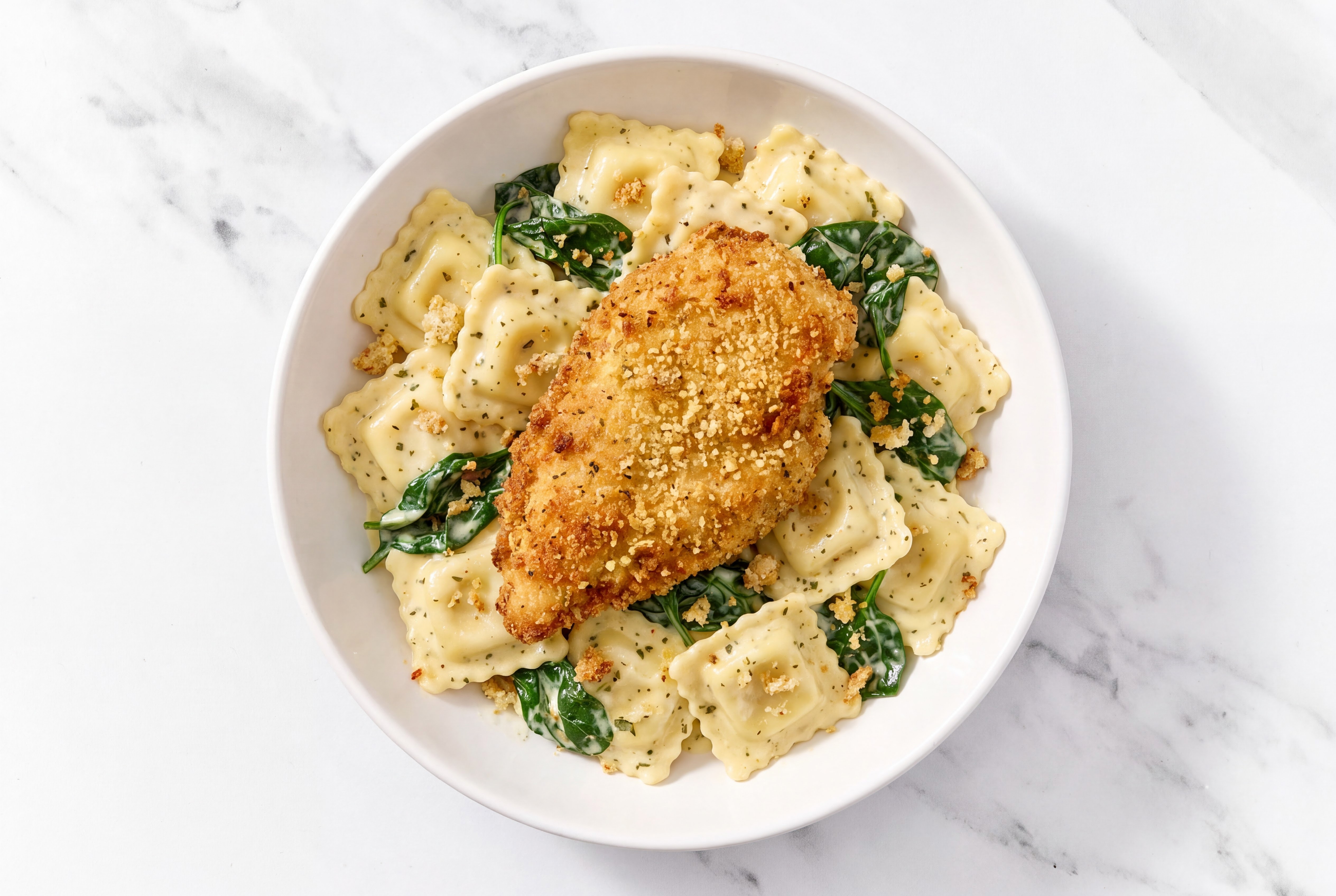 Crispy Garlic Chicken over Creamy Ravioli with Baby Spinach