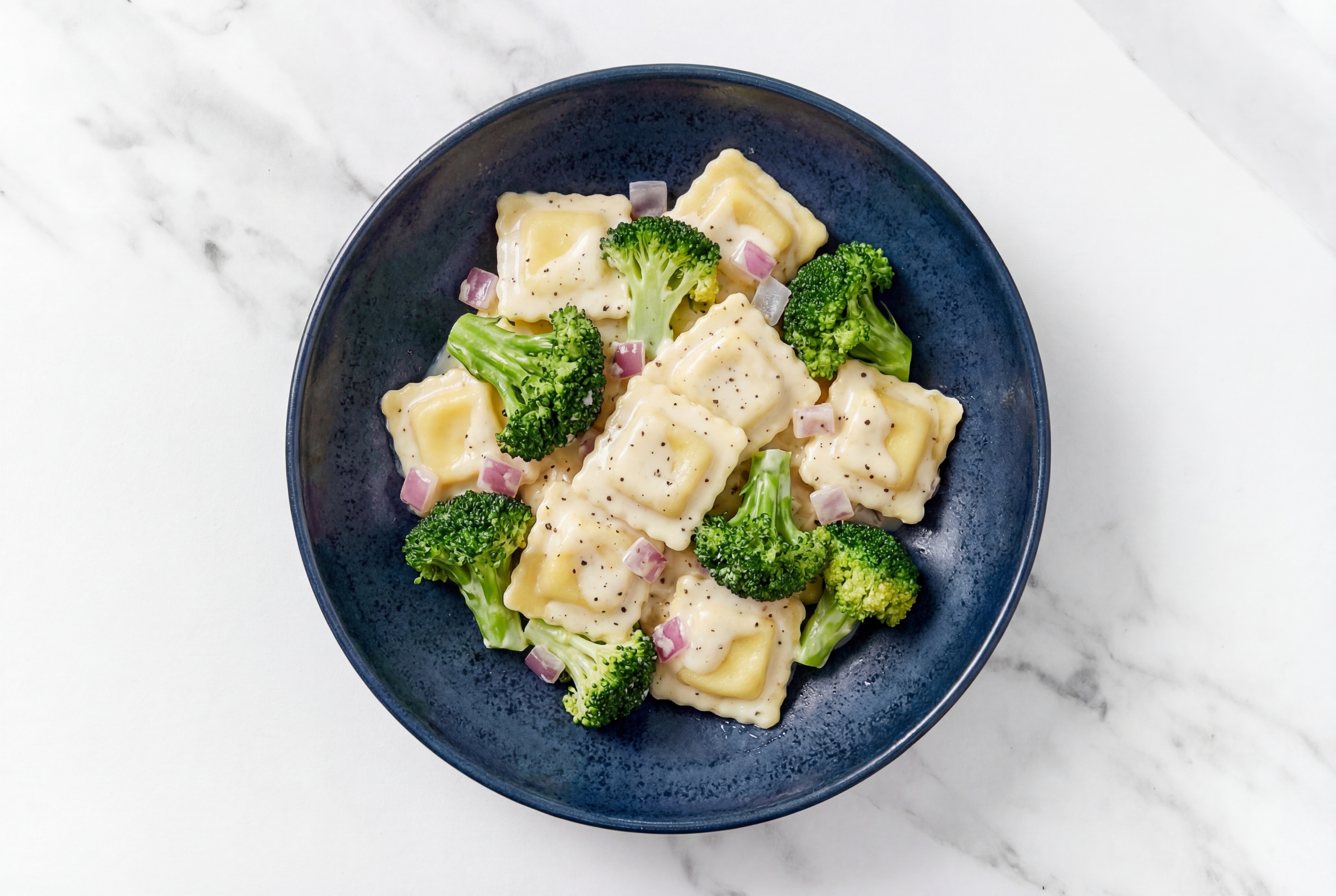 Creamy Ravioli Alfredo with Broccoli Bunches