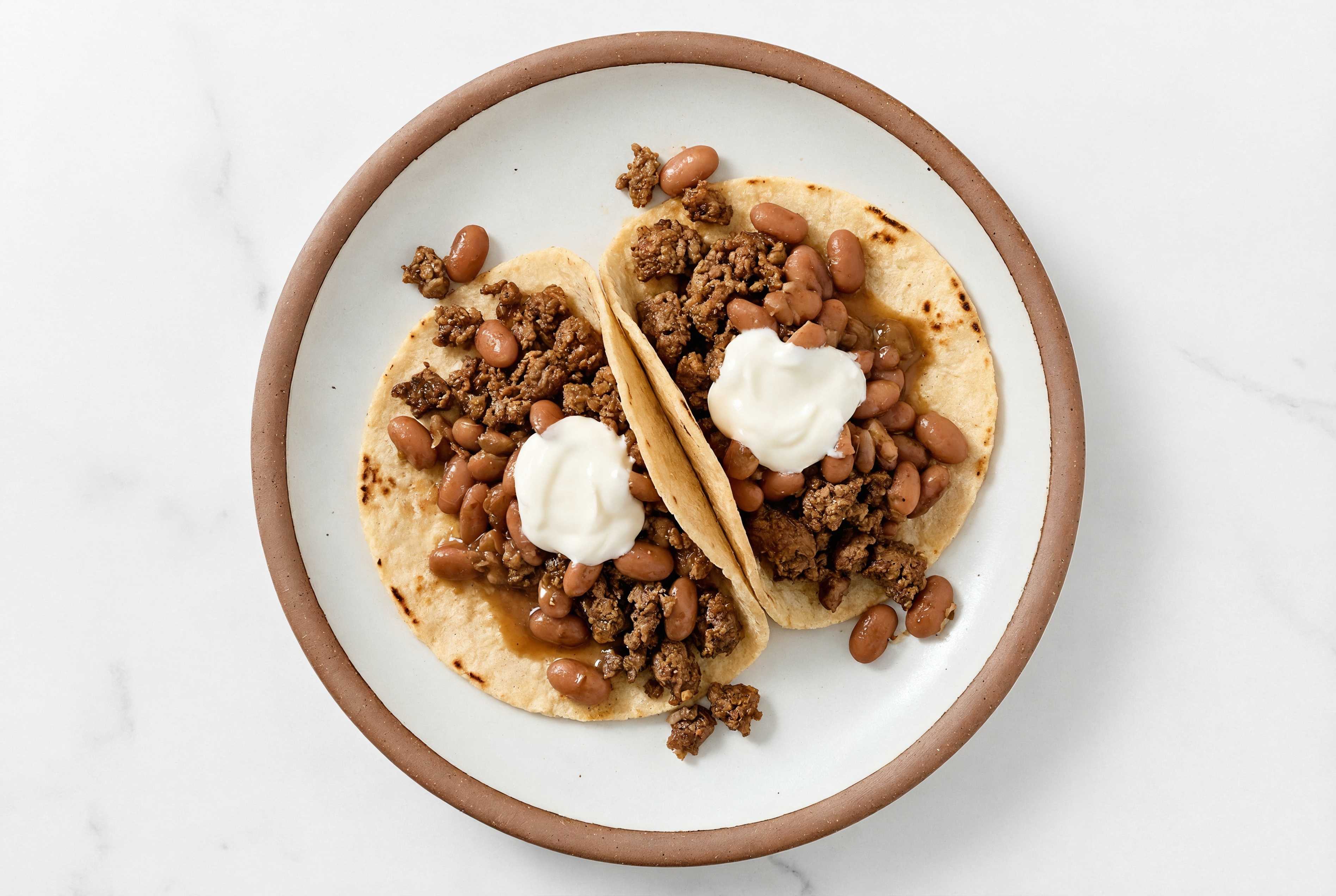 Mexican-Style Ground Beef Tacos with Crema & Pinto Beans
