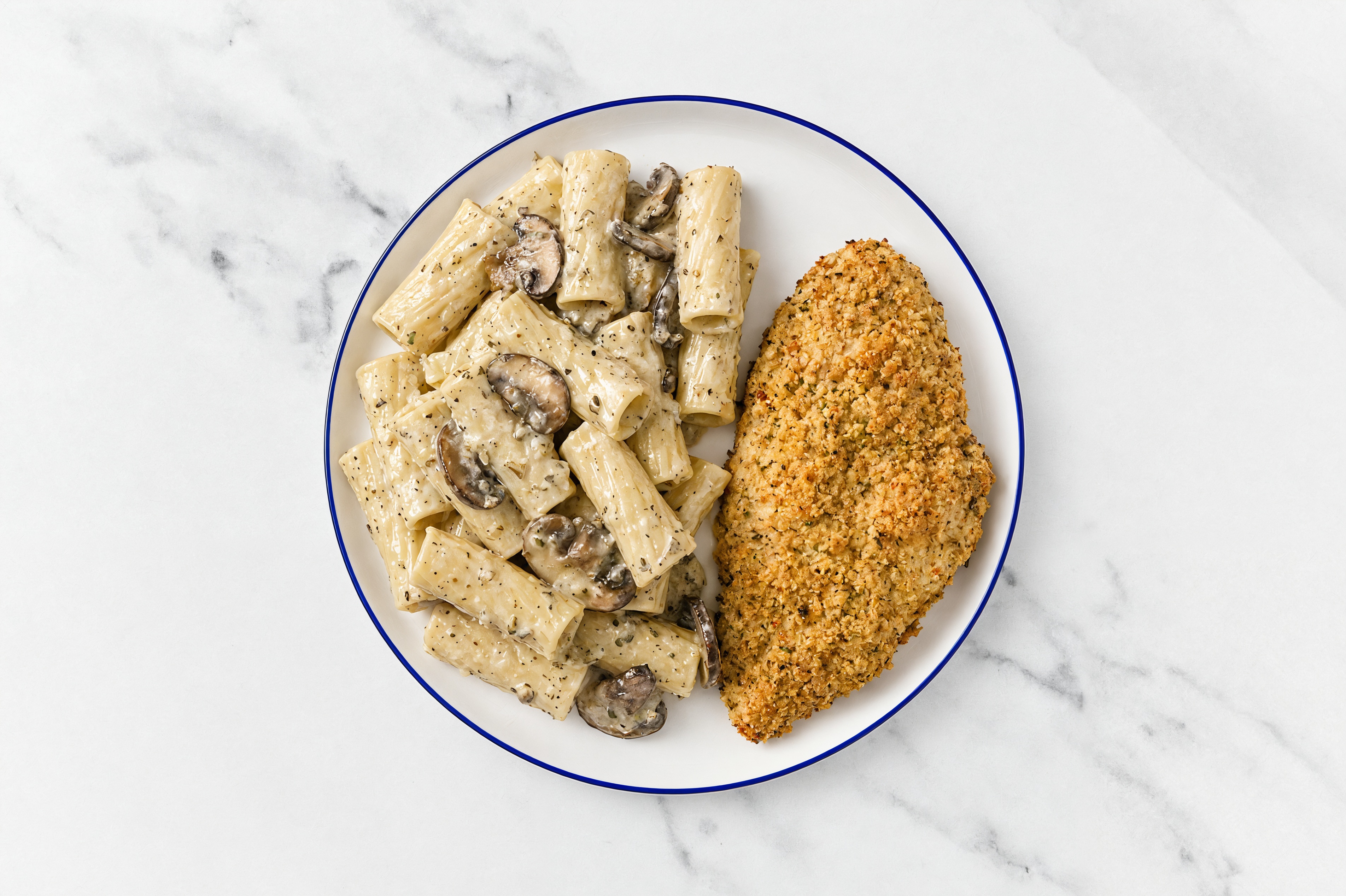 Crispy Garlic Chicken over Creamy Rigatoni with Baby Bella Mushrooms