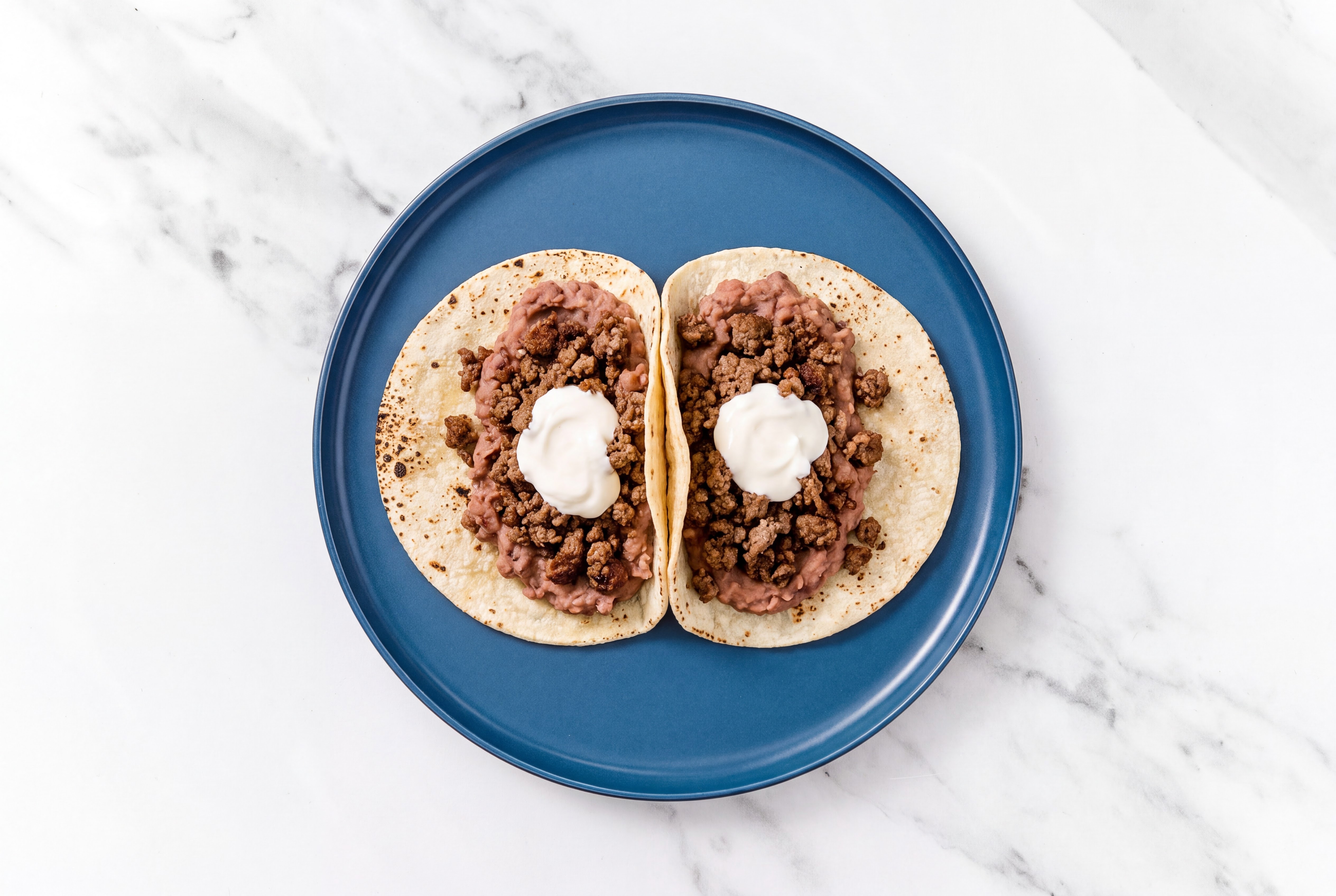 Hearty Ground 93/7 Lean Beef Tacos with Crema & Refried Red Beans
