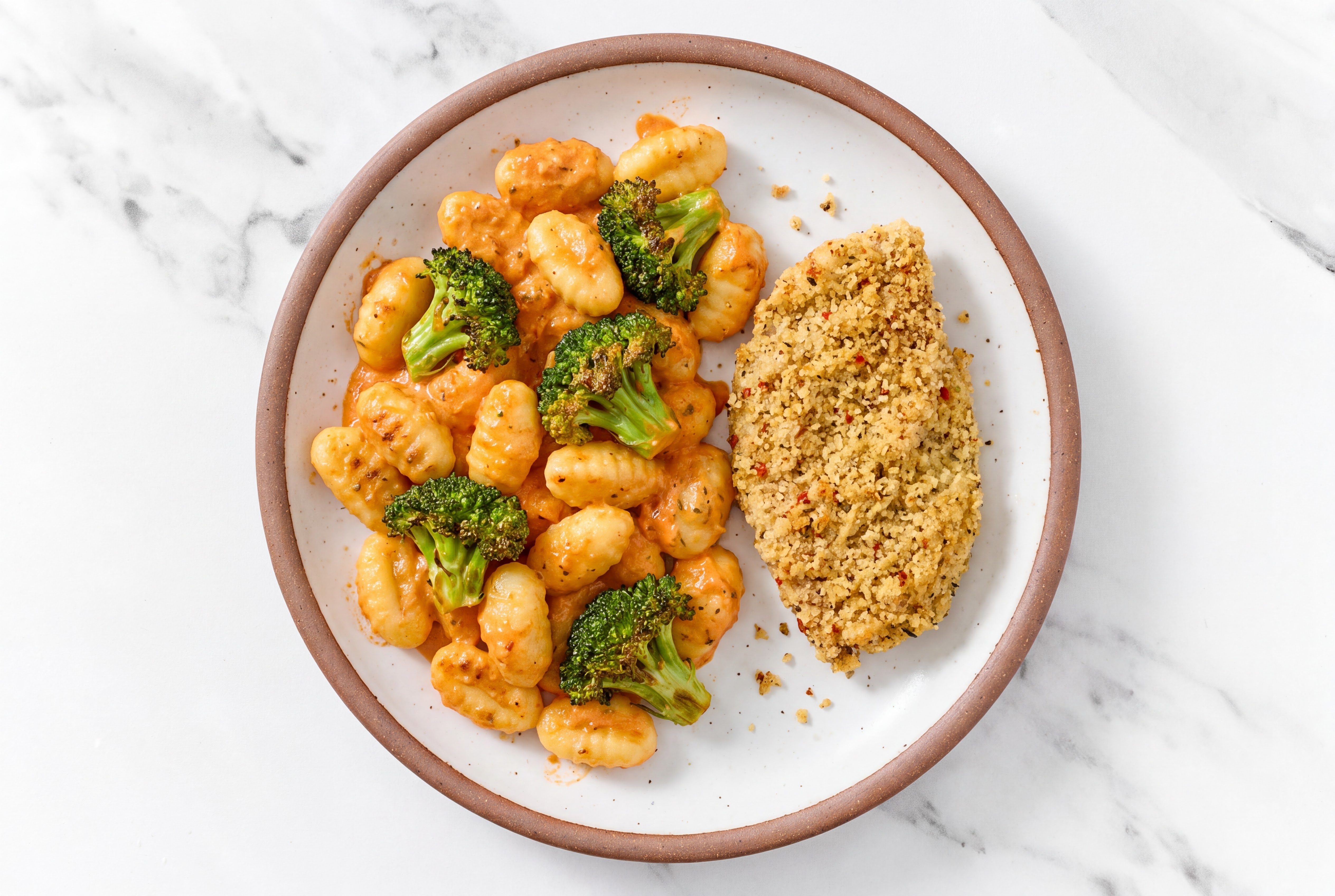 Crispy Garlic Chicken over Creamy Vodka Gnocchi with Broccoli