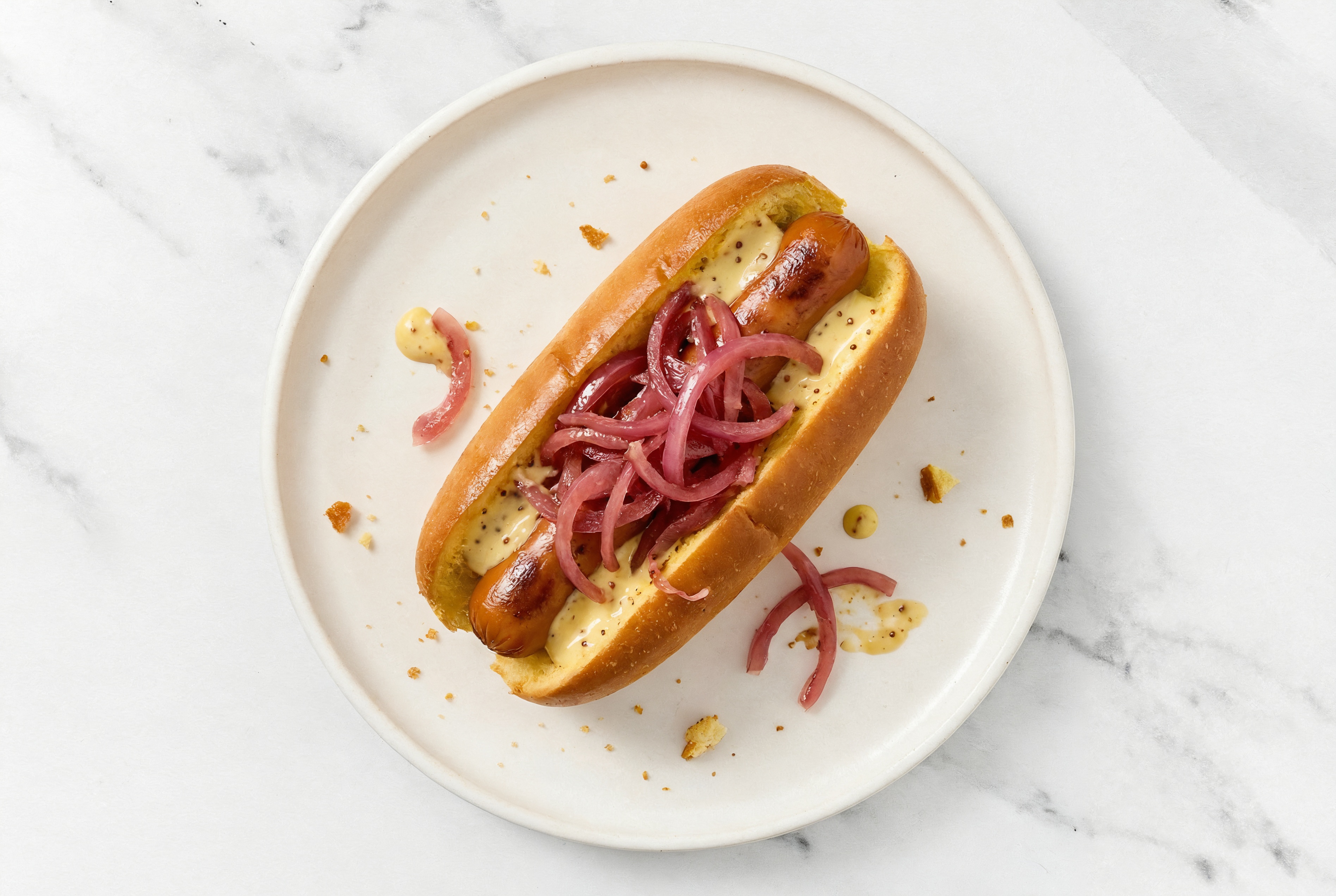 Pickled Red Onion Smart Dog with Honey Mustard on Brioche