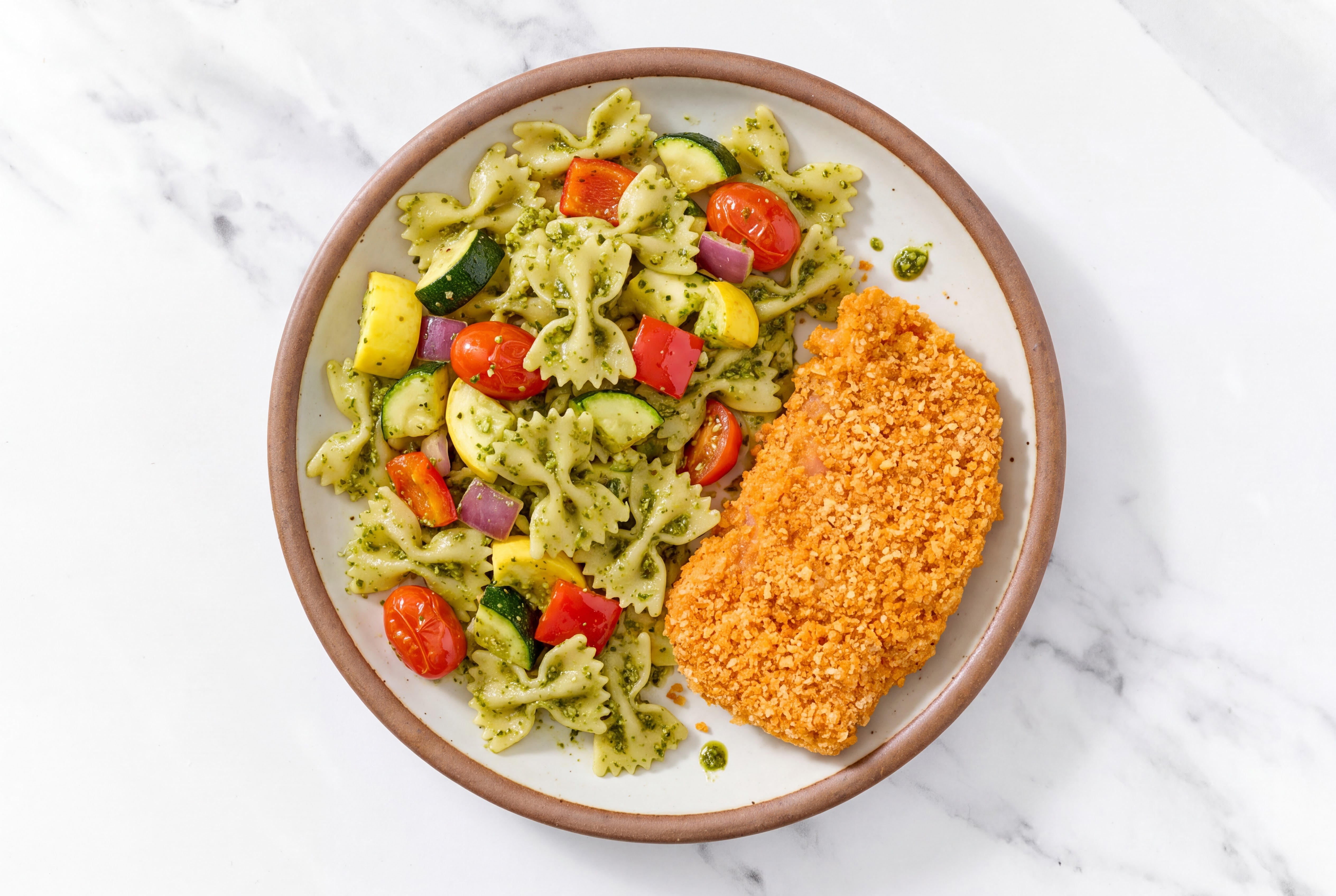 Crispy Hot Honey Chicken over Pesto Farfalle with Mixed Veggies