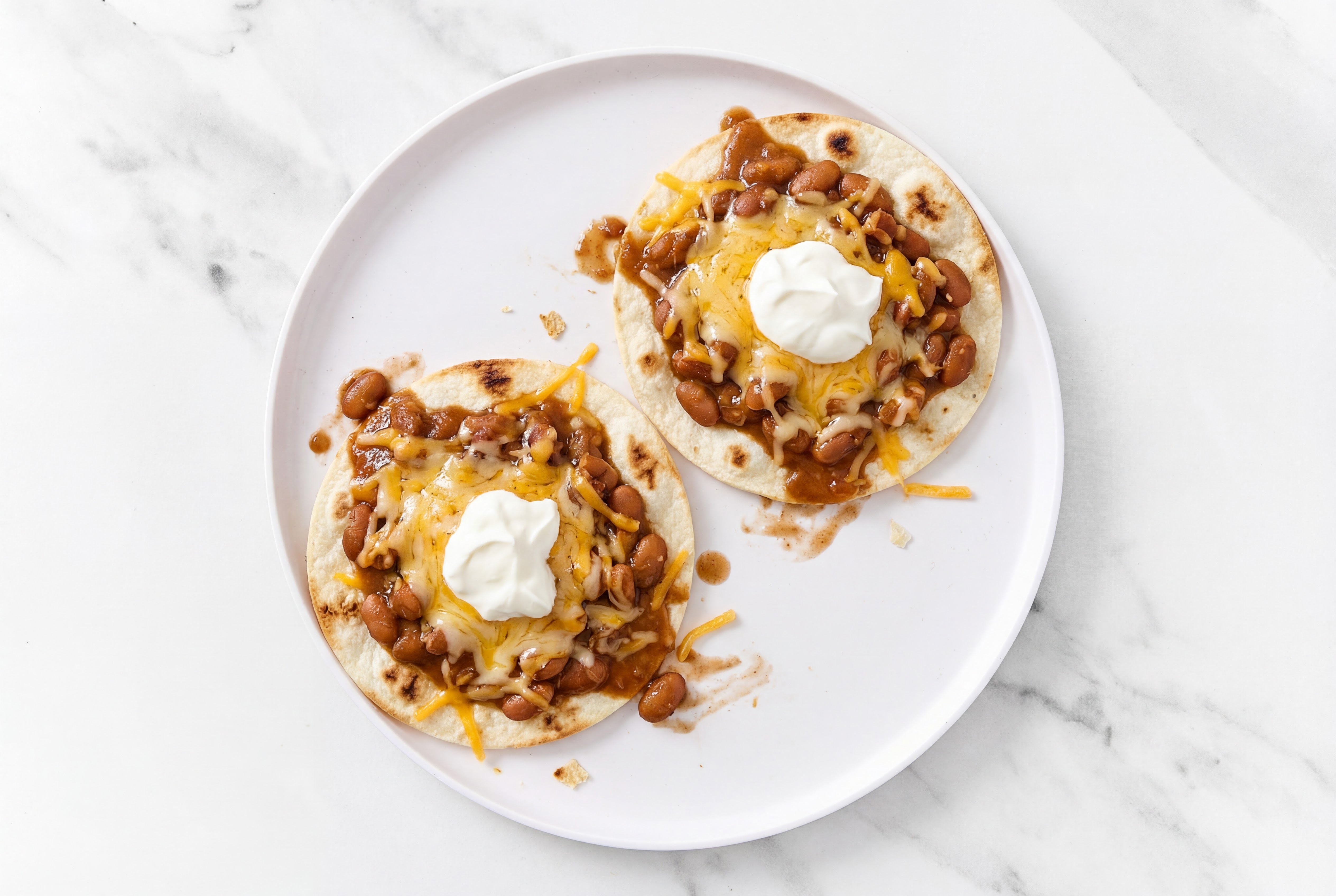 Herby Cheesy Pinto Bean Tostadas with Shredded Sharp Cheddar Cheese