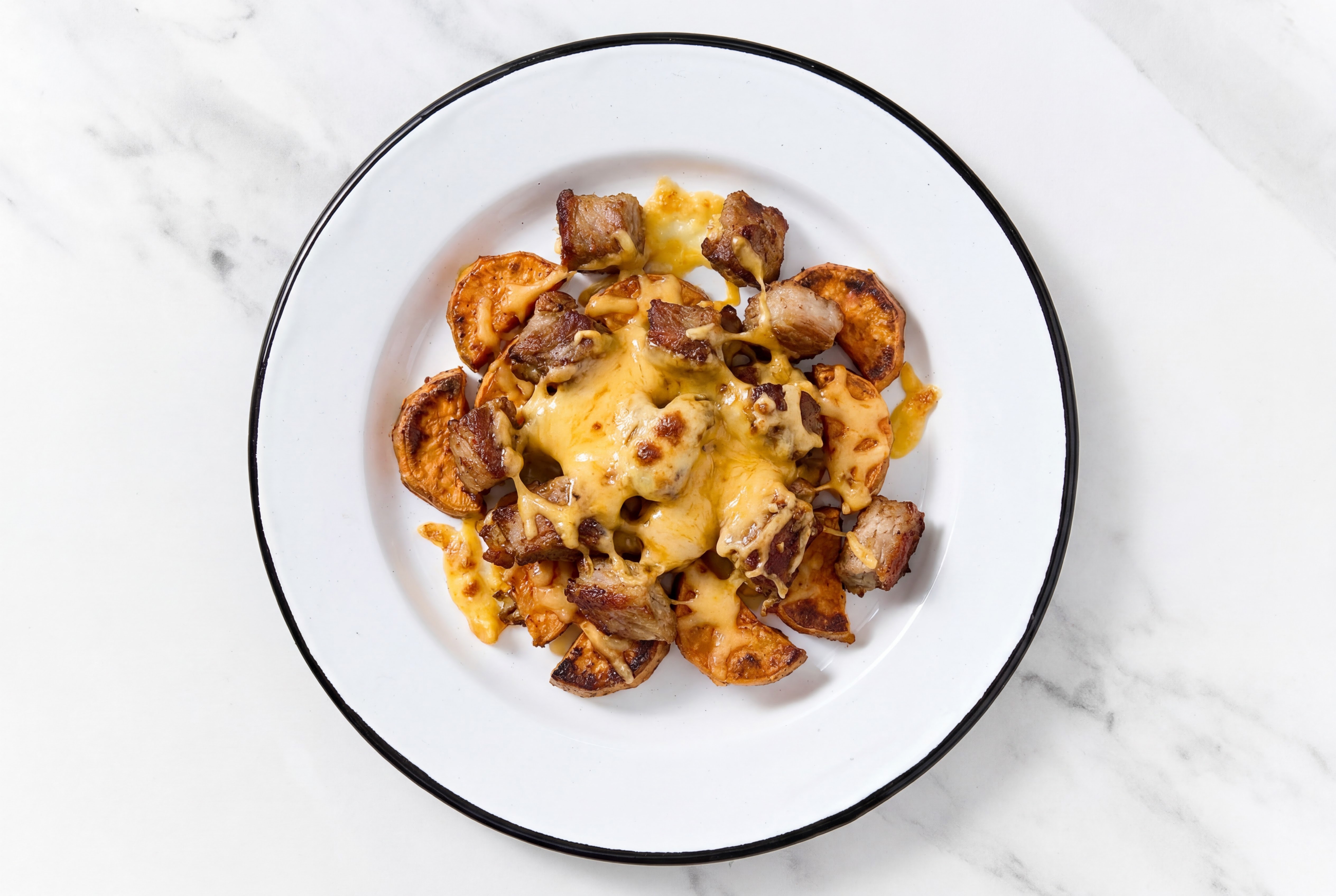 Effortless Carnitas Loaded Sweet Potatoes with Shredded Sharp Cheddar Cheese