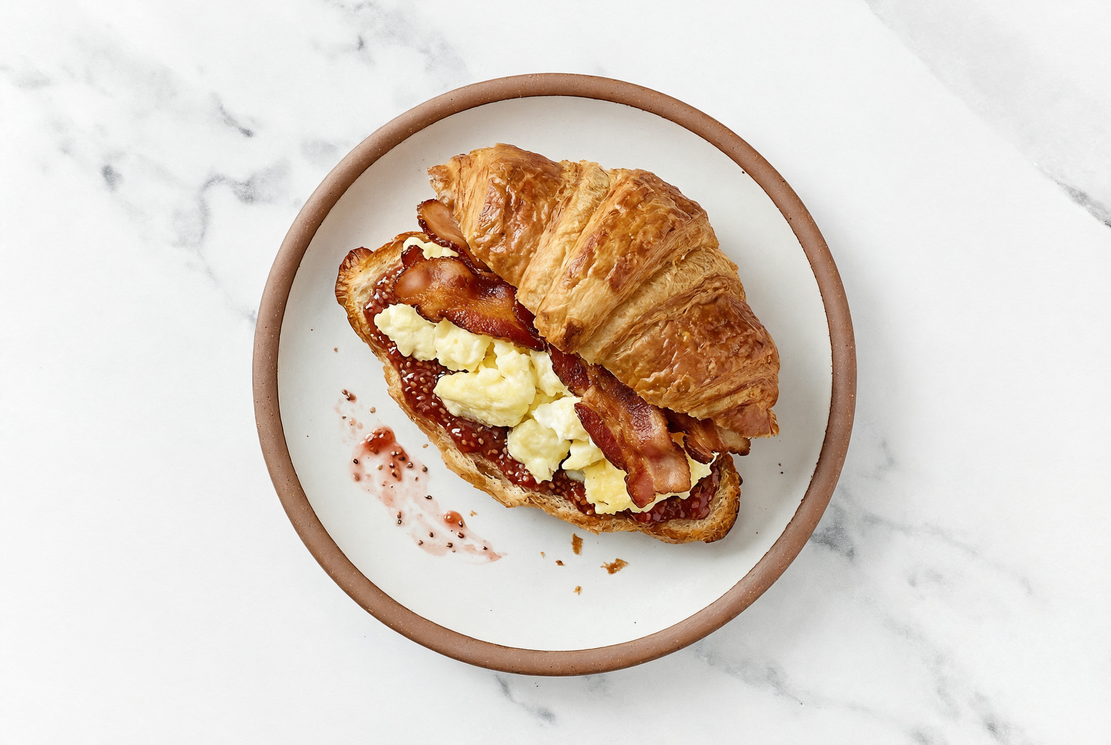 Applewood Smoked Pork Bacon, Egg White + Strawberry Jam Croissant Sandwich