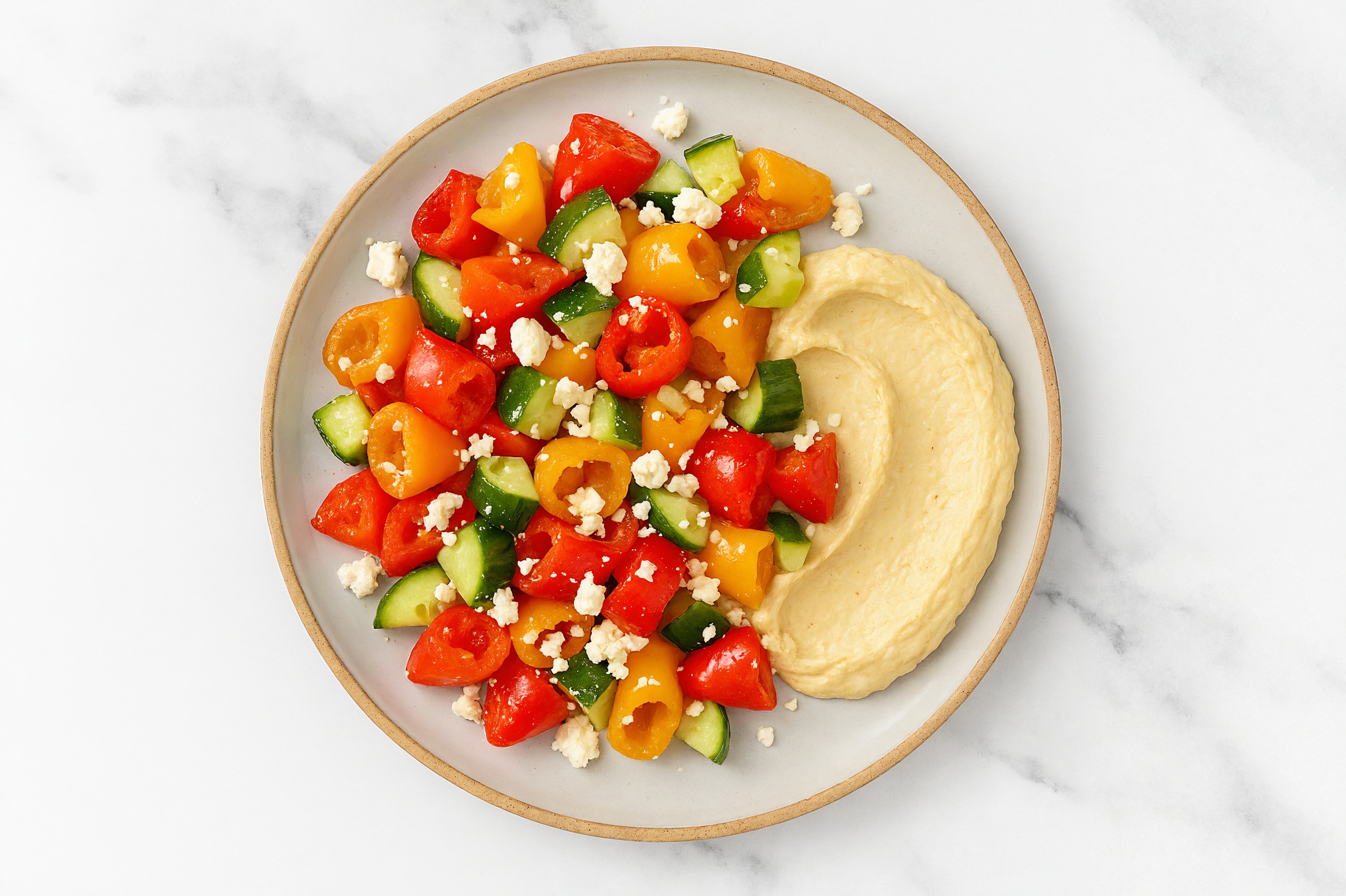 Crumbled Chevre Sweet Pepper Cucumber Bowl over Lemon Garlic Hummus