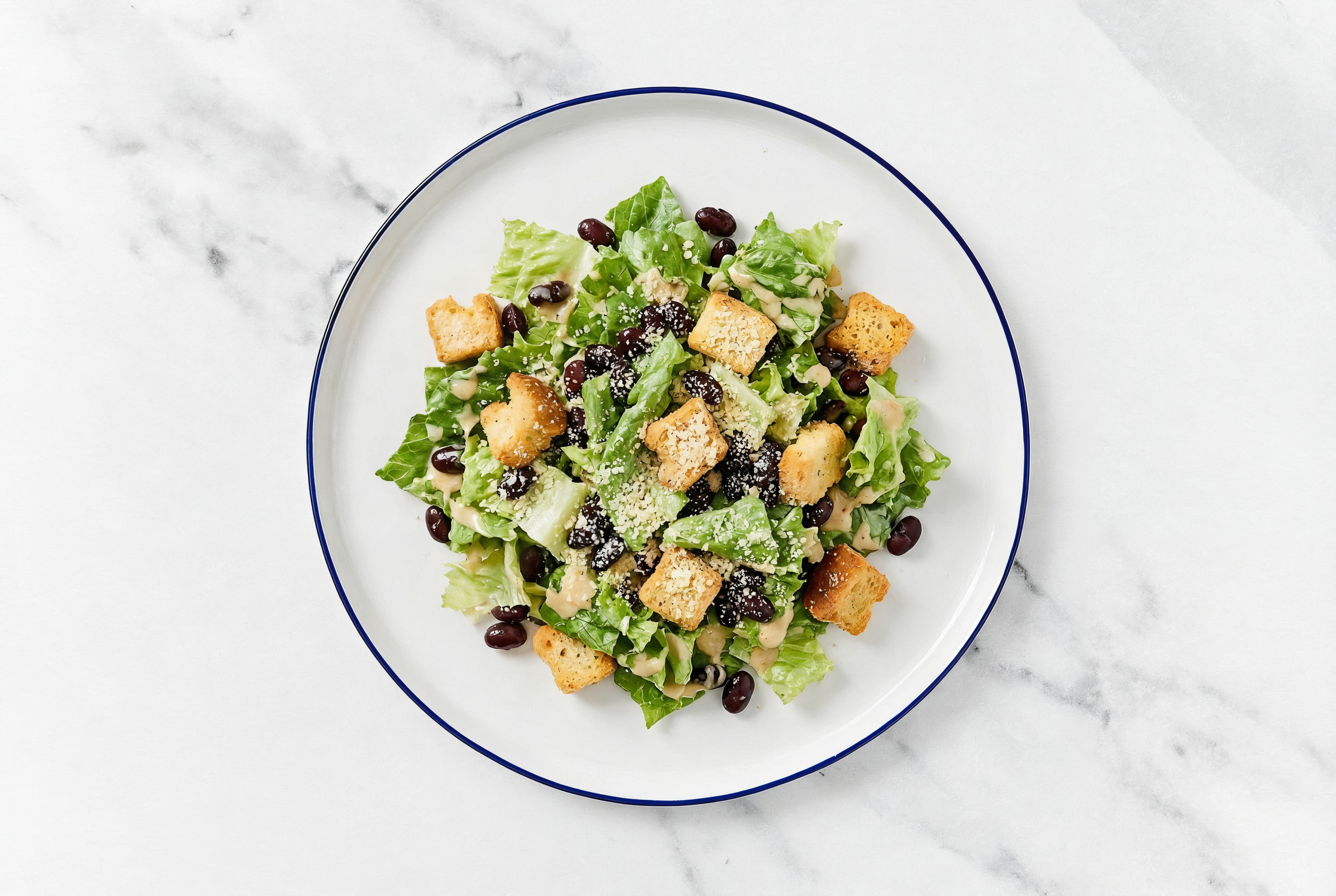 Creamy Miso Black Bean Caesar with Grated Parmesan Cheese