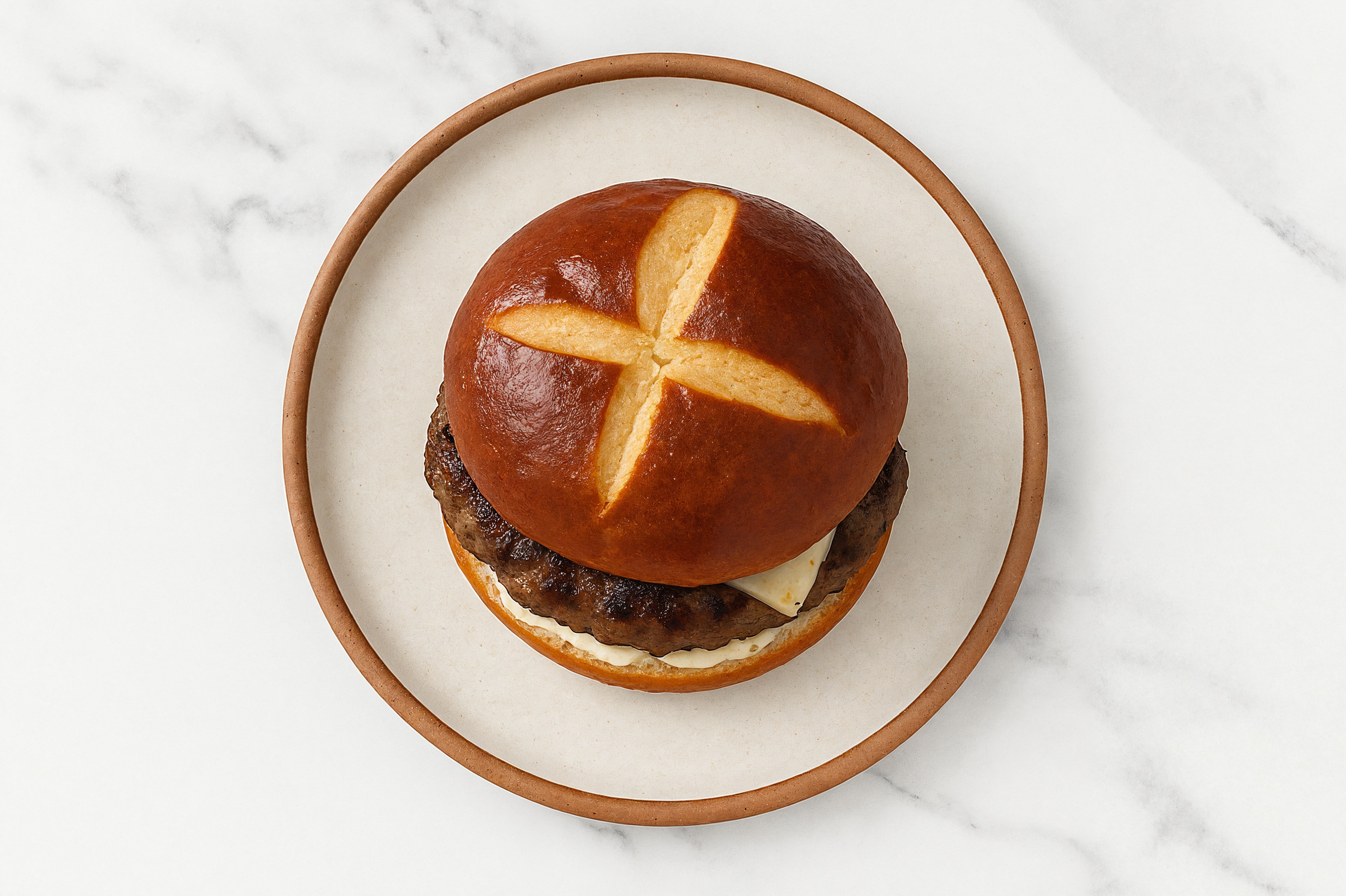 Lamb Burger on Pretzel with Tzatziki & Pepper Jack