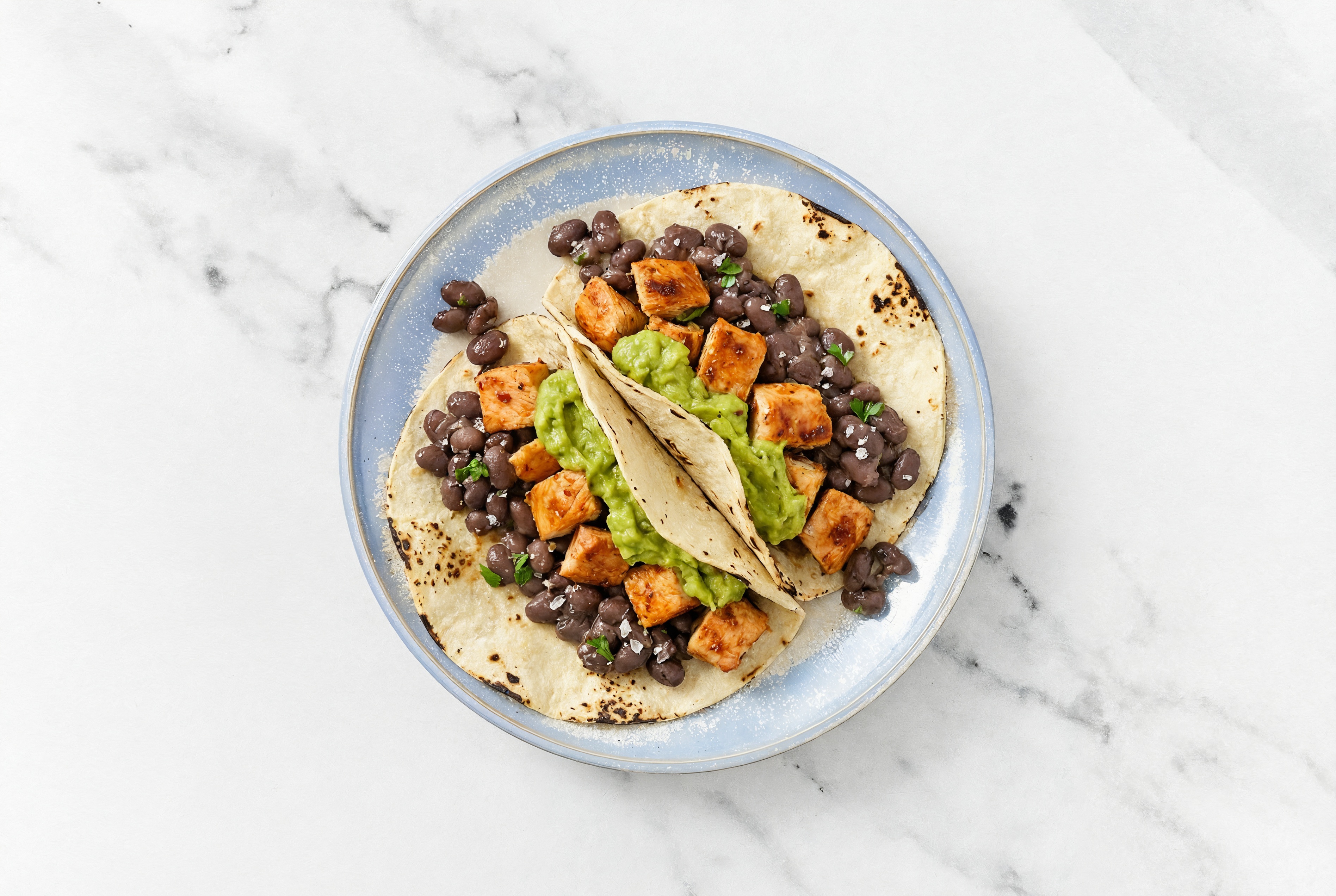 Hearty Chipotle Chicken Tacos with Guacamole & Spiced Beans