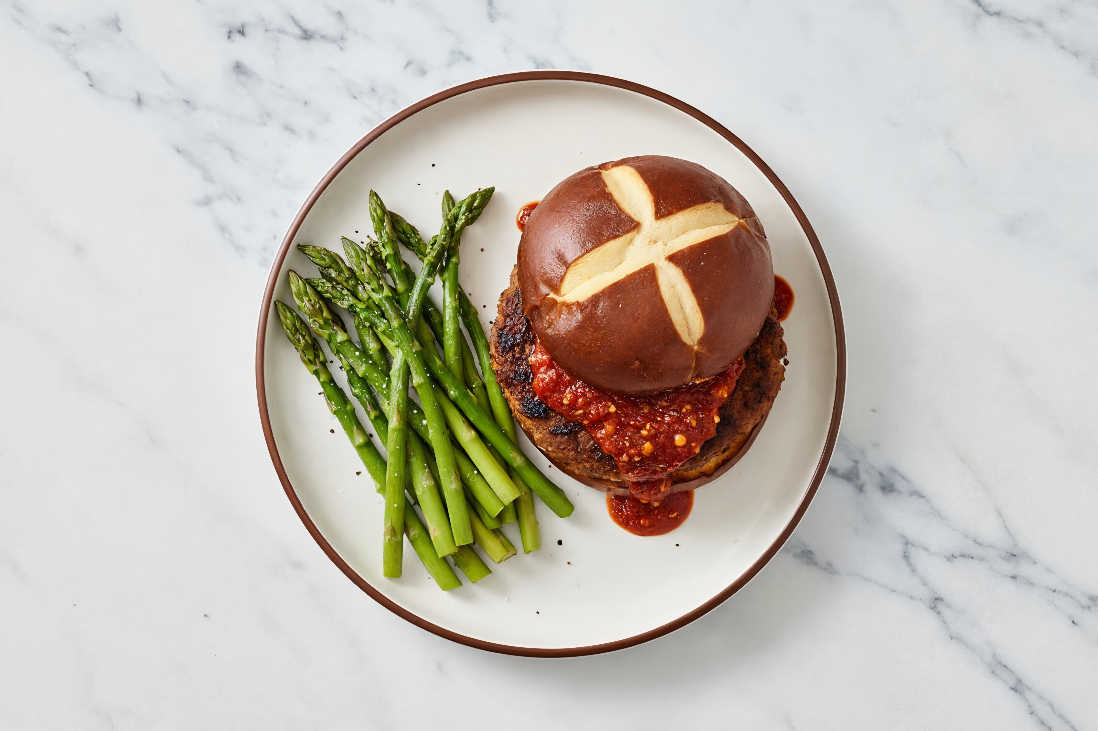 Herby Chili Crisp Beyond Burger on Pretzel Bun
