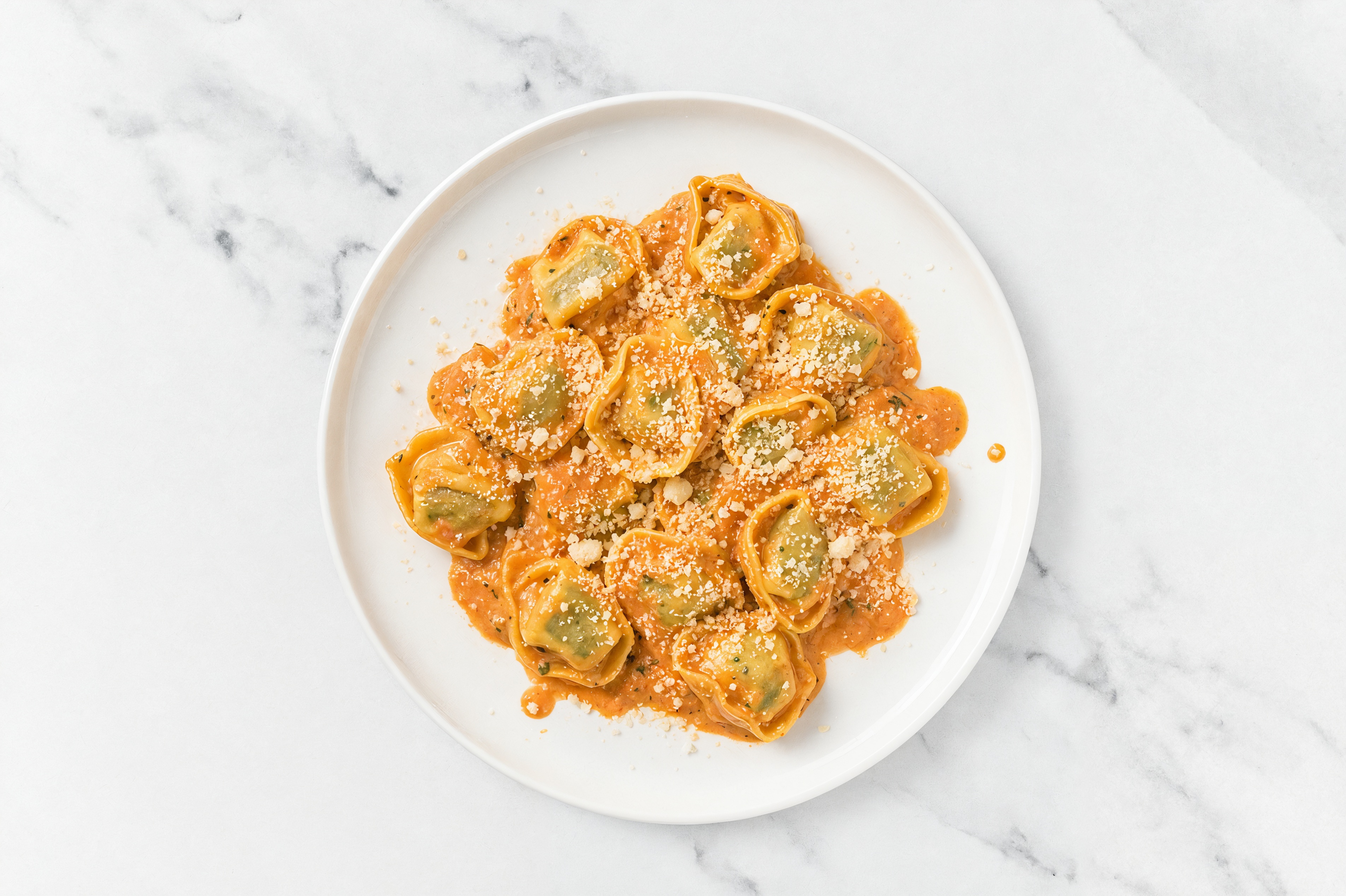 Red Sauce Cheese Tortellini with Grated Parmesan Cheese