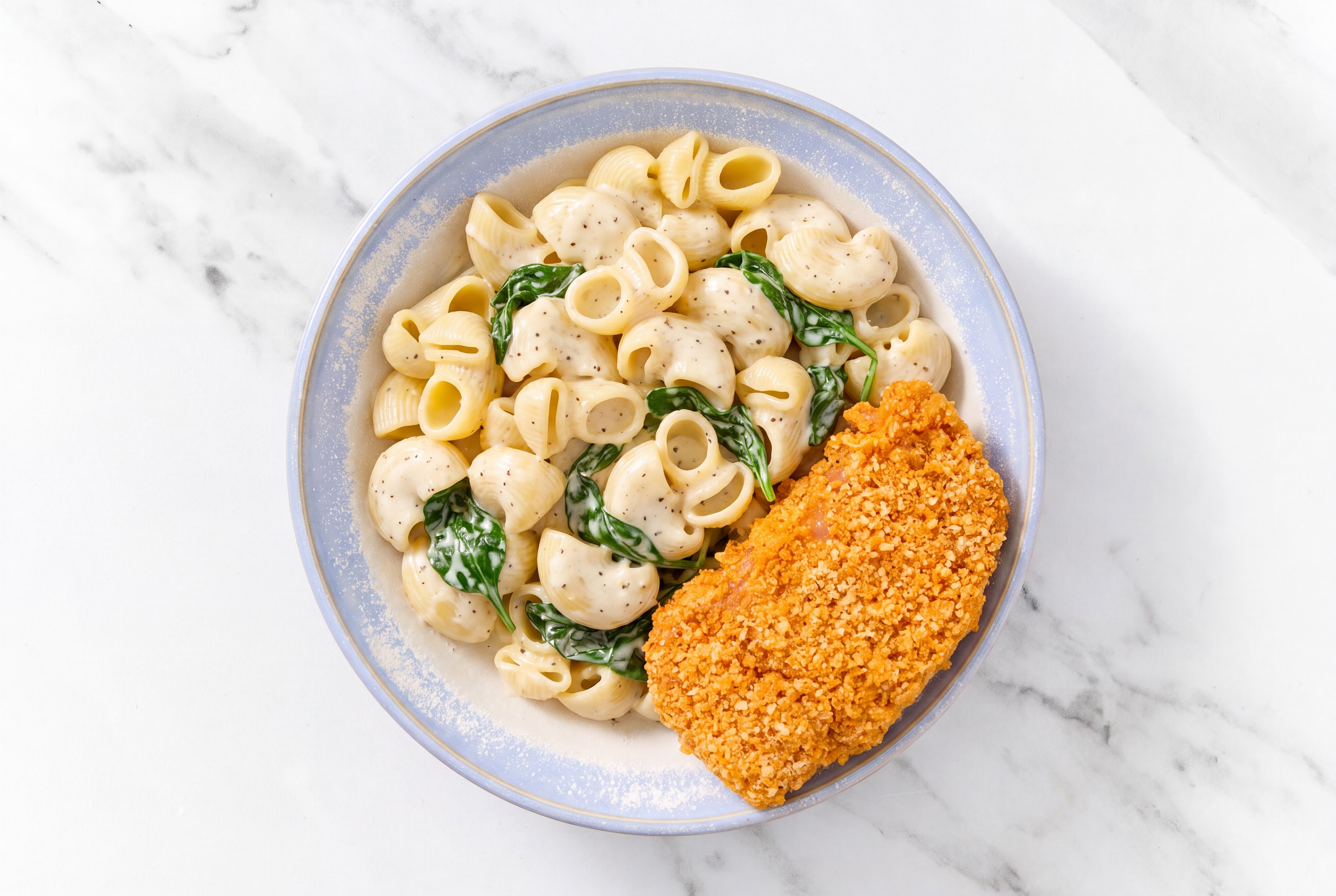 Crispy Hot Honey Chicken over Alfredo Chiocciole Pasta with Baby Spinach
