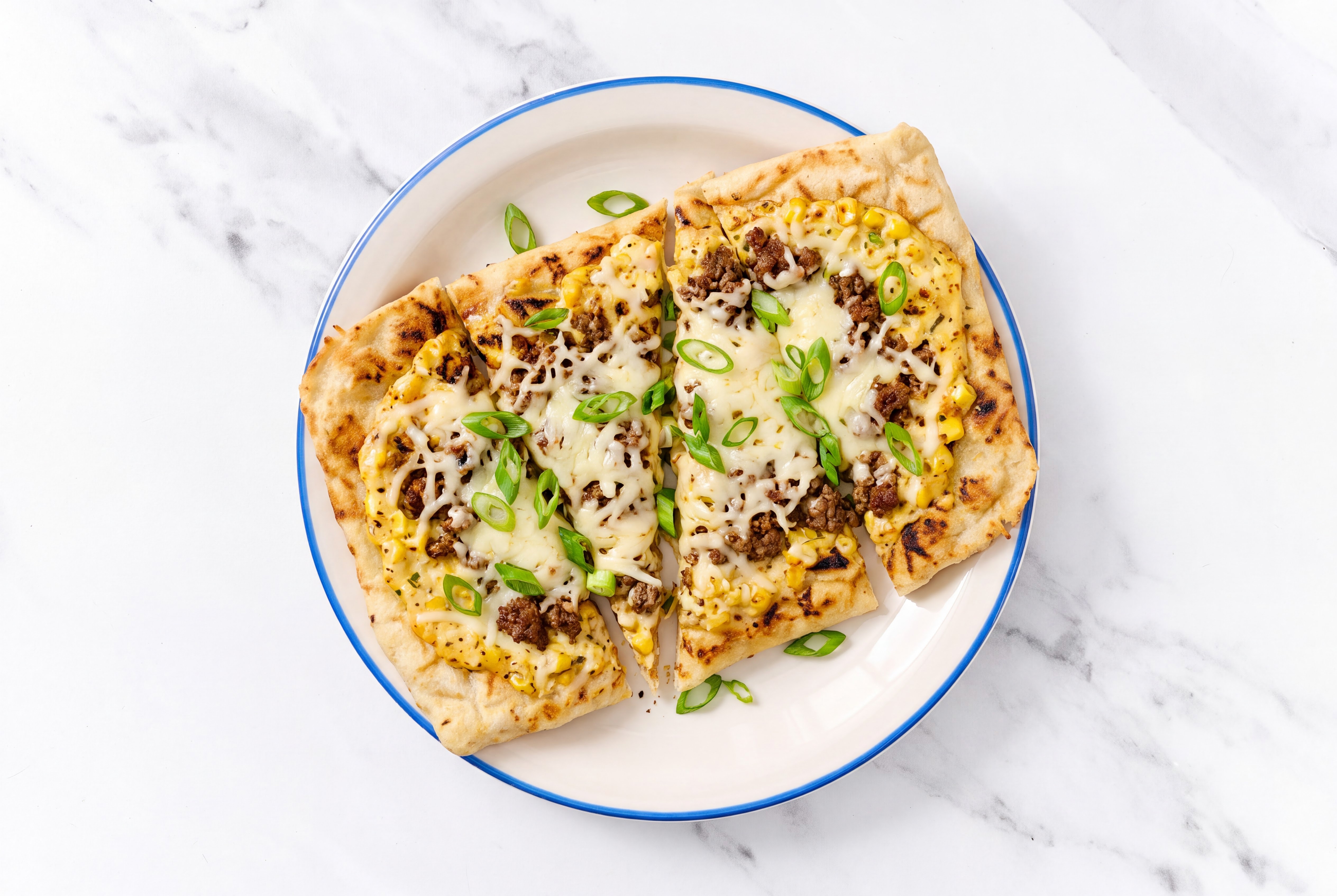 Street Corn Ground 93/7 Lean Beef Grilled Pizza with Mozzarella + Fresh Scallions