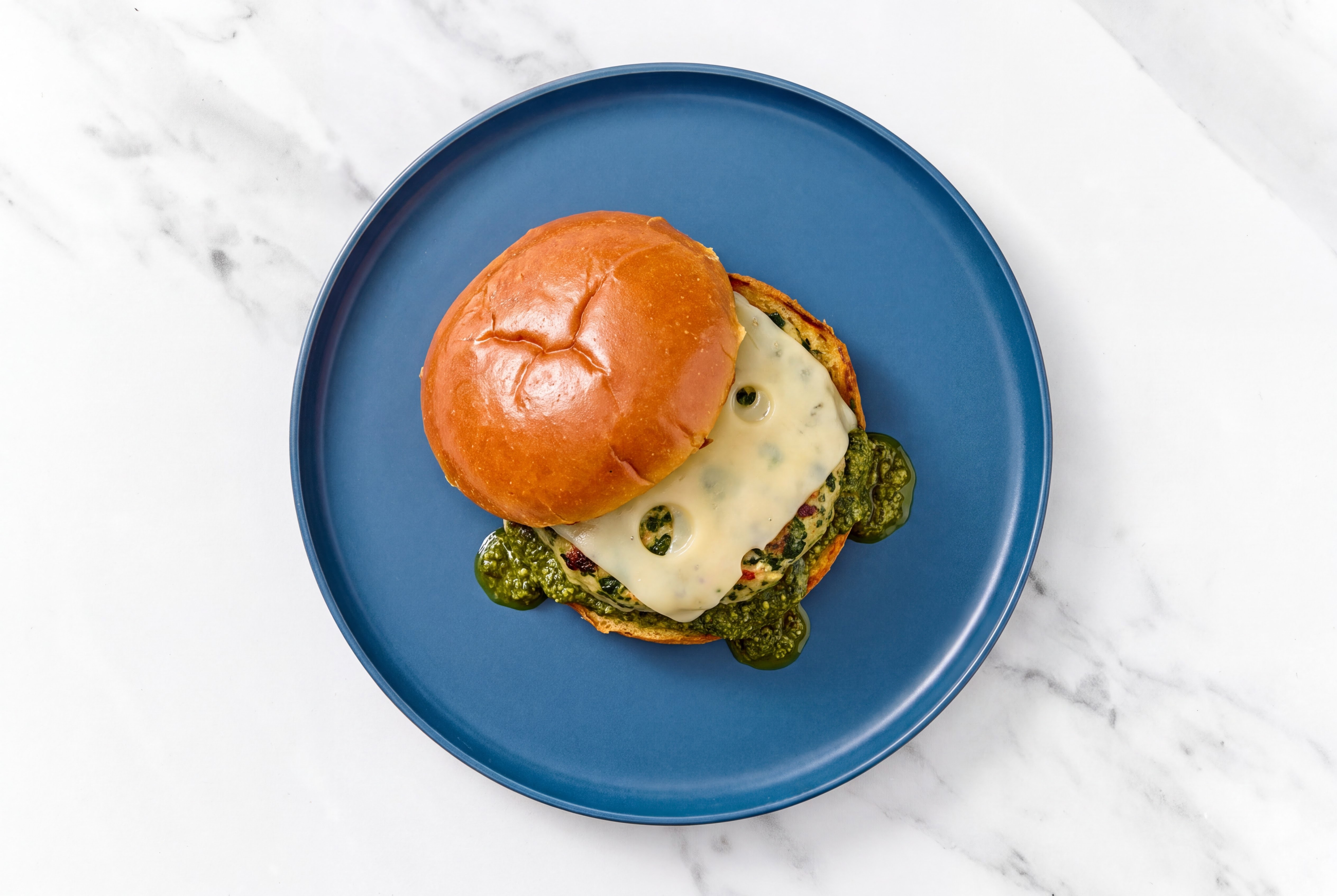 Garlic Turkey Burger on Brioche with Spinach Pesto & Swiss