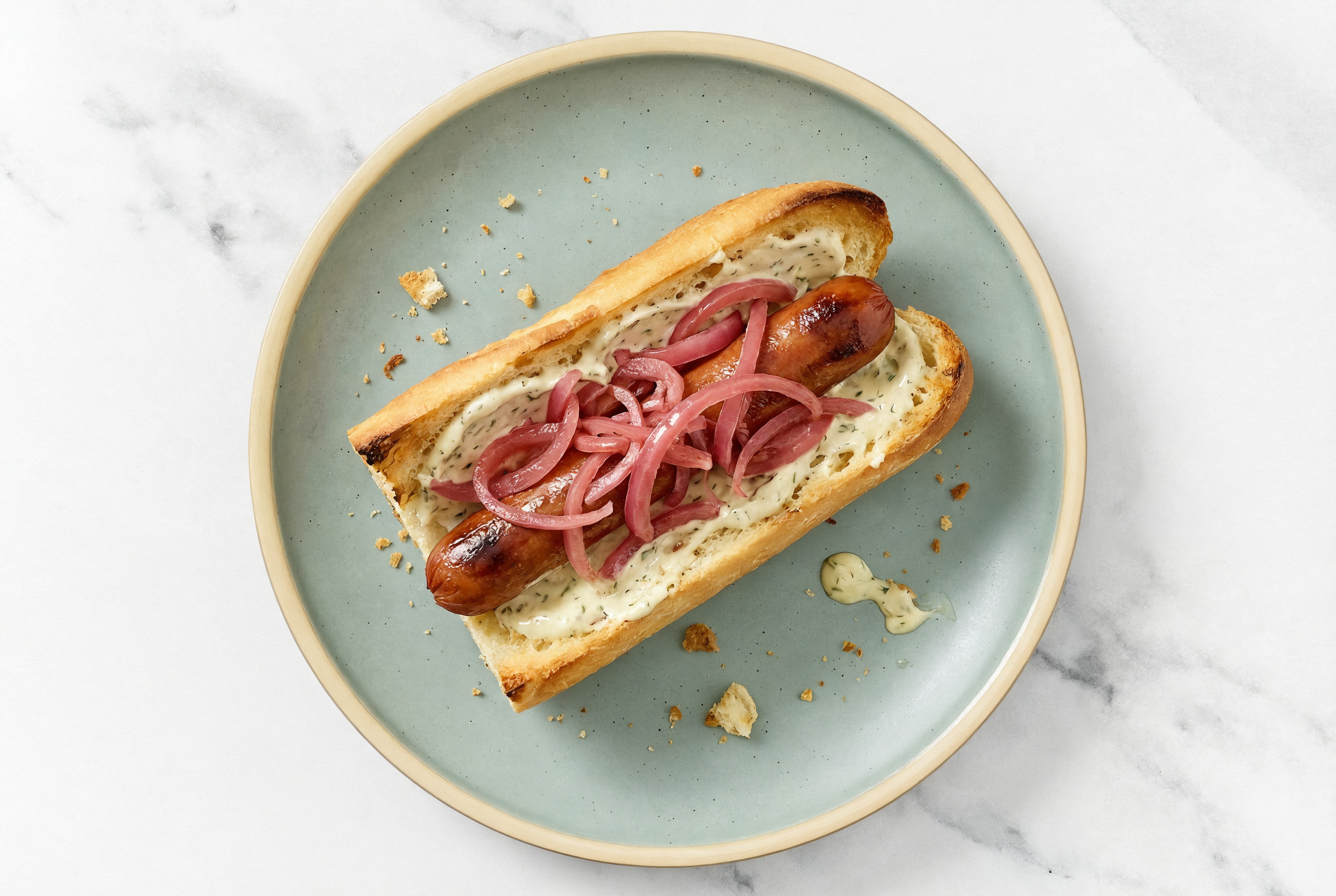 Pickled Red Onion Beef Hot Dog with Garlic Sauce on Baguette