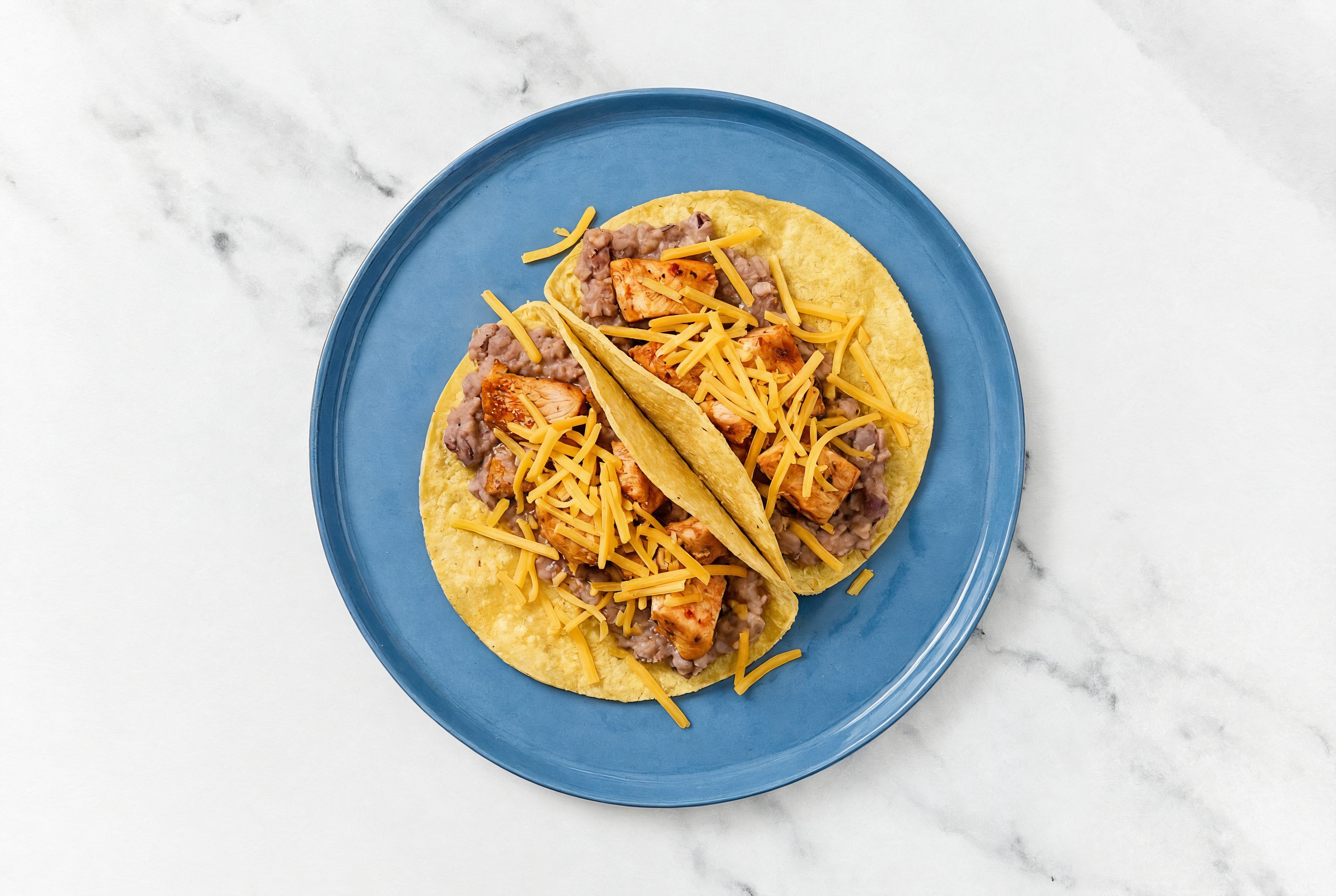 Herby Chipotle Chicken Tacos with Cheddar Cheese & Refried Red Beans