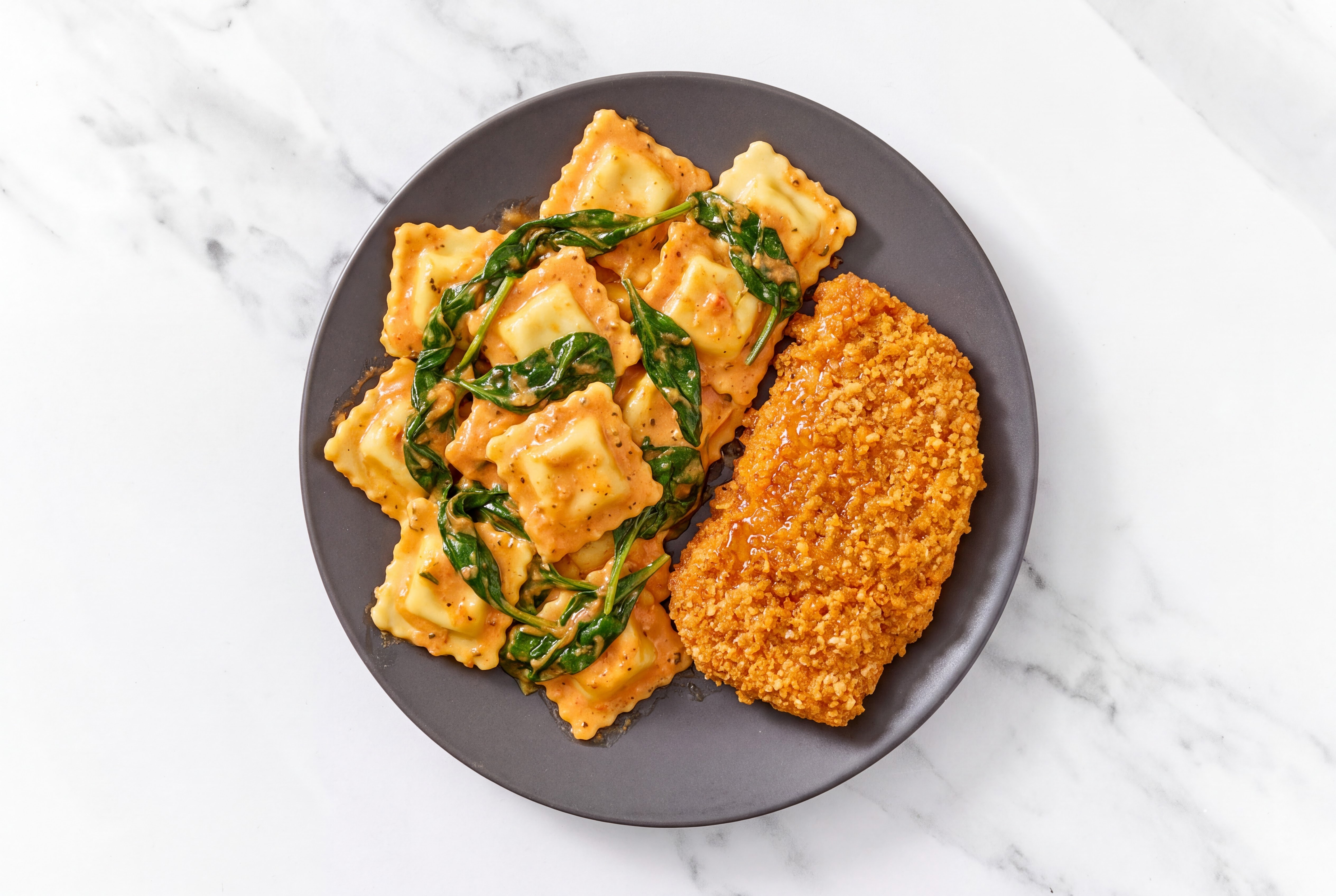 Crispy Hot Honey Chicken over Creamy Vodka Ravioli with Baby Spinach