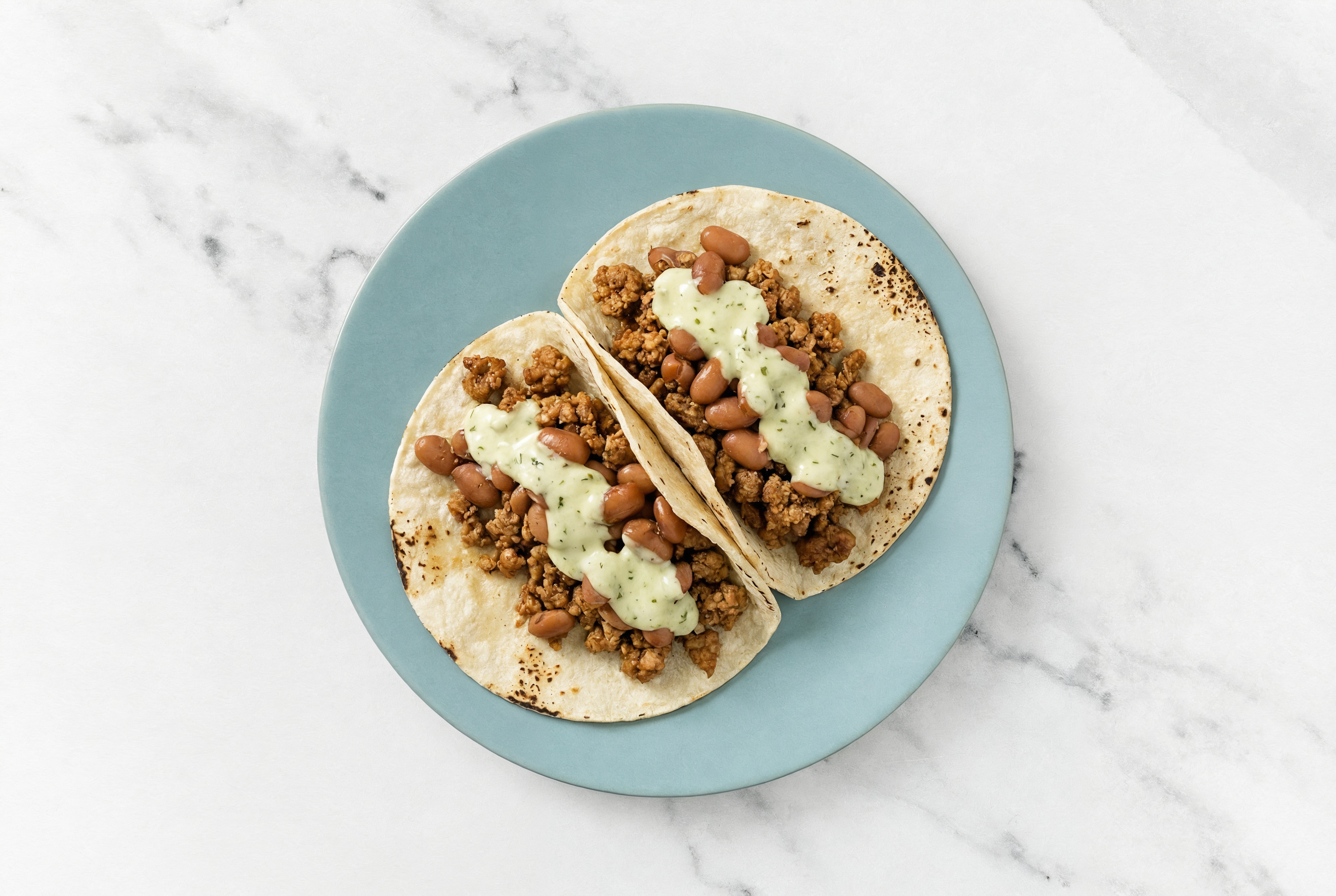 Hearty Ground Turkey Tacos with Jalapeño Crema & Pinto Beans