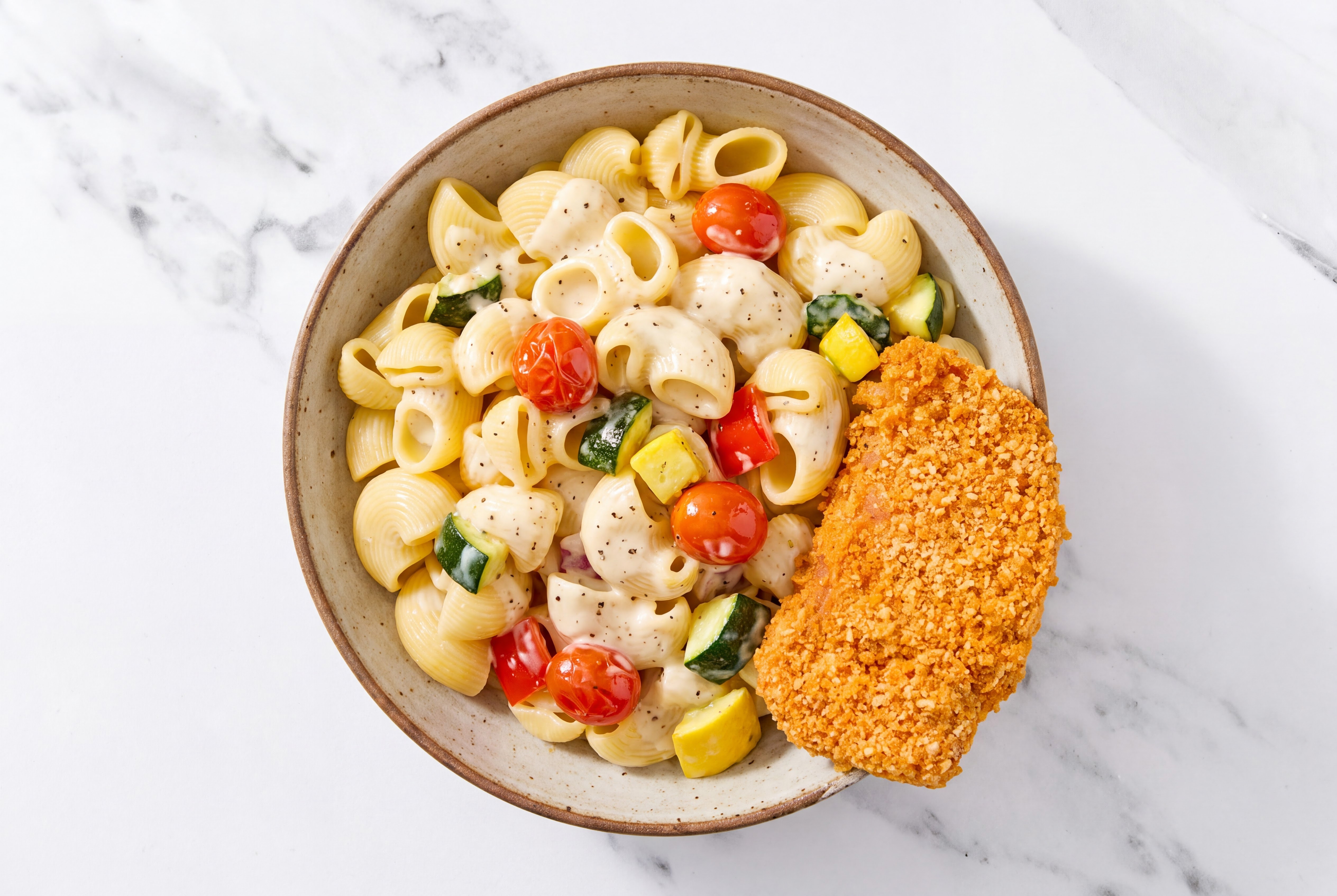 Crispy Hot Honey Chicken over Alfredo Chiocciole Pasta with Mixed Veggies