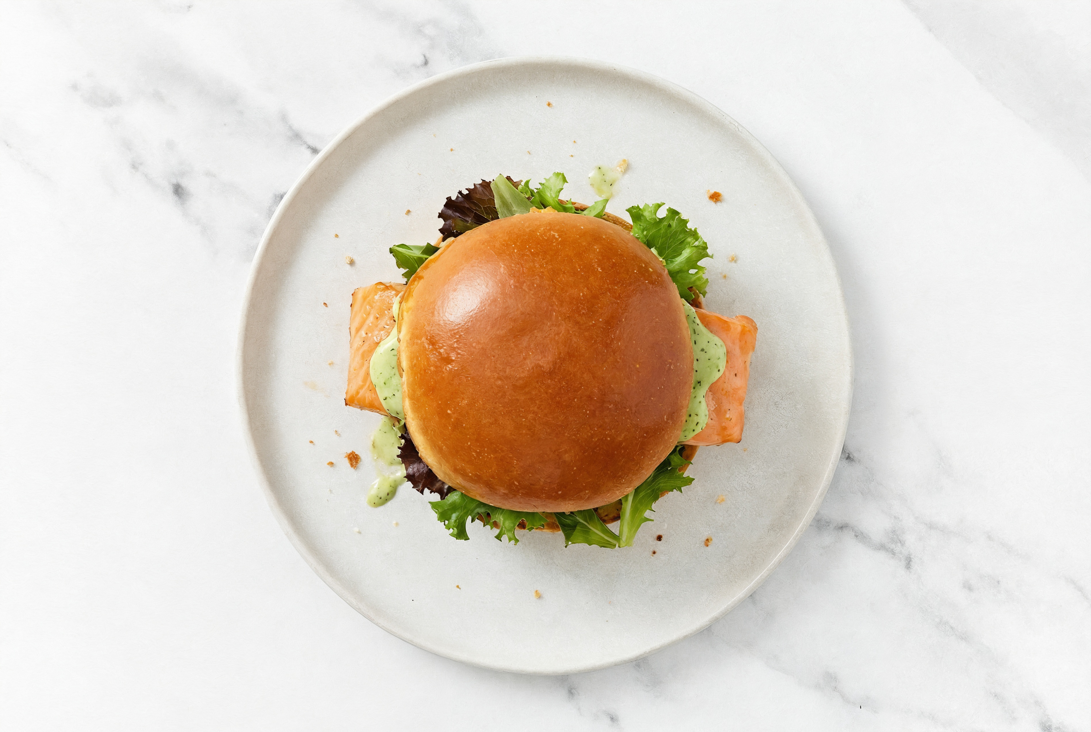Green Goddess Salmon Sandwich on Brioche with Spring Mix