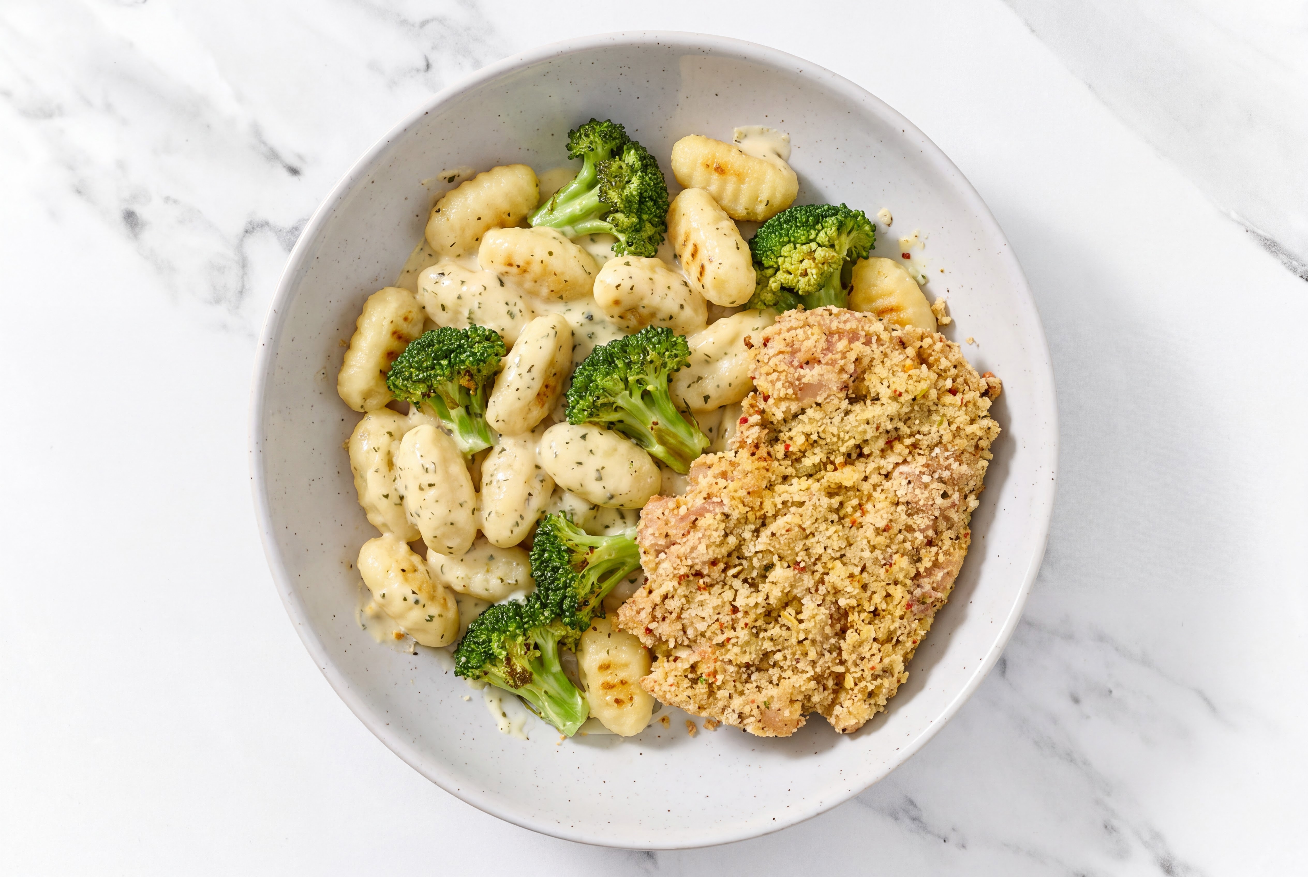 Crispy Garlic Chicken over Creamy Gnocchi with Broccoli