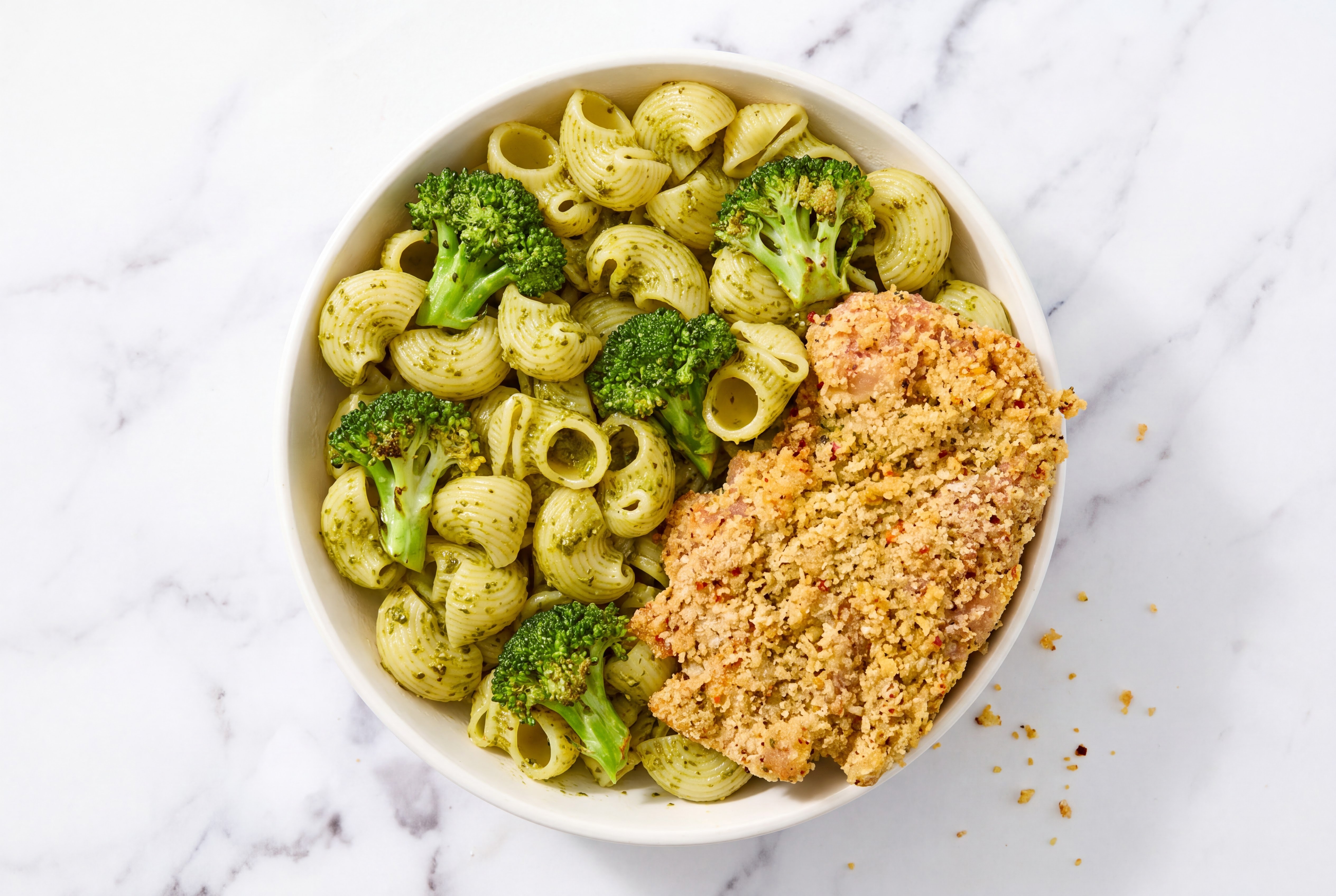 Crispy Garlic Chicken over Pesto Chiocciole Pasta with Broccoli