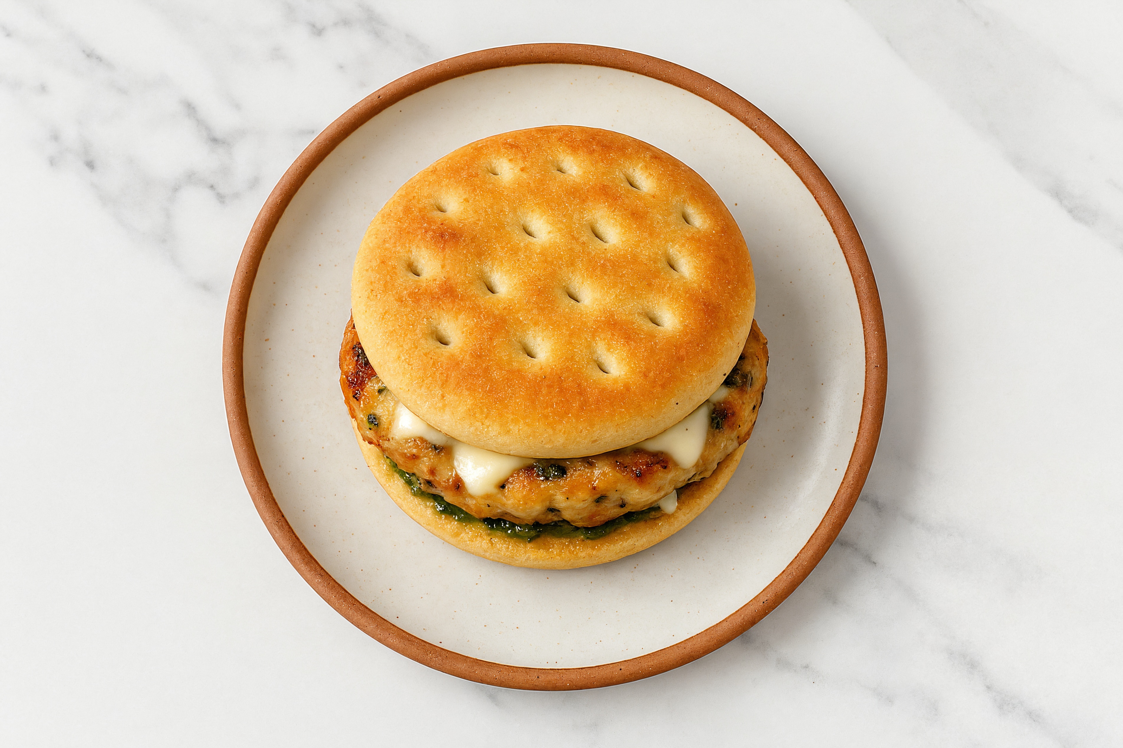 Bruschetta Chicken Patties with Mozzarella Ball + Pesto Aioli on Brioche Buns