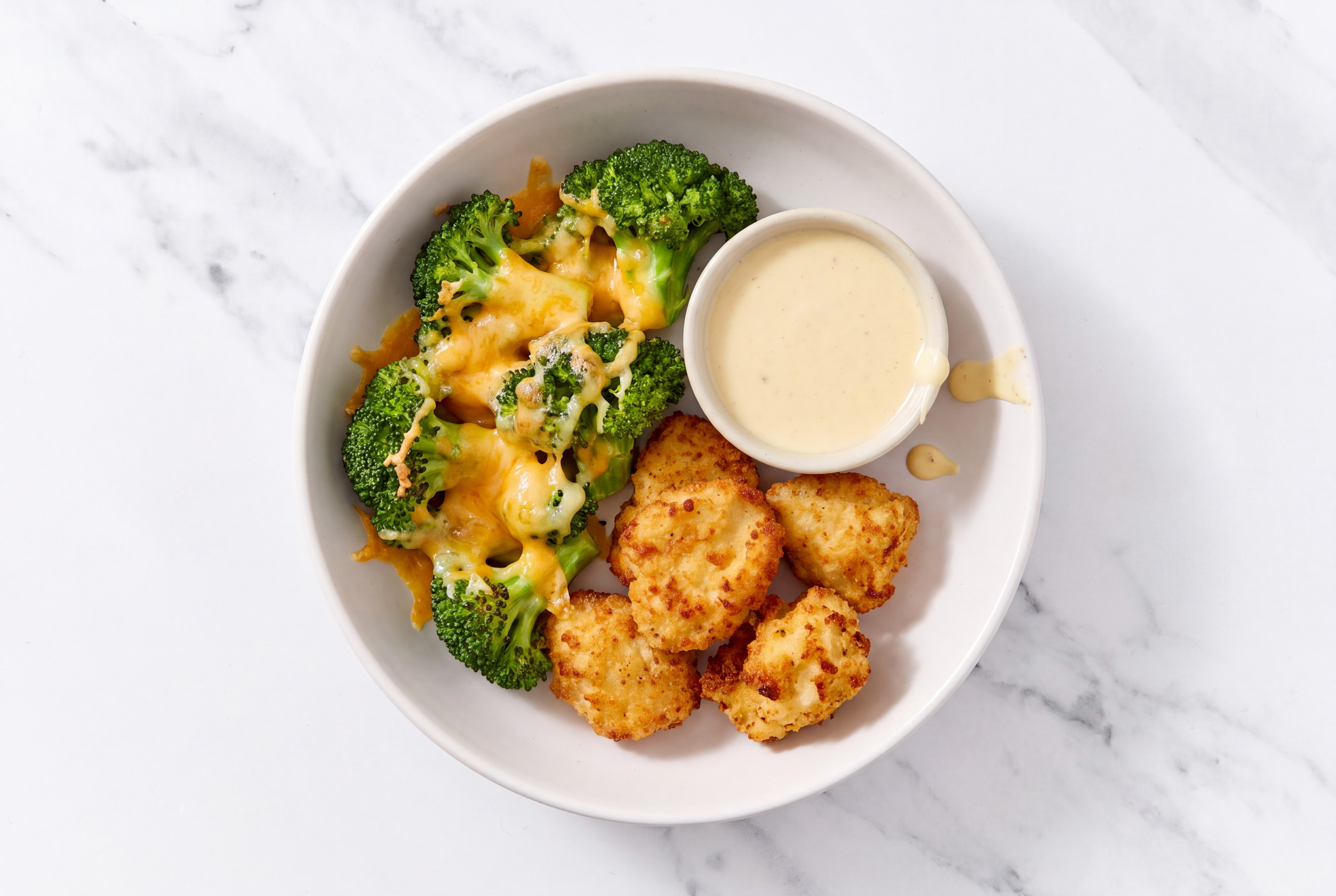 Chicken Nuggets + Cheesy Broccoli with Miso Caesar with Sharp Cheddar Bar