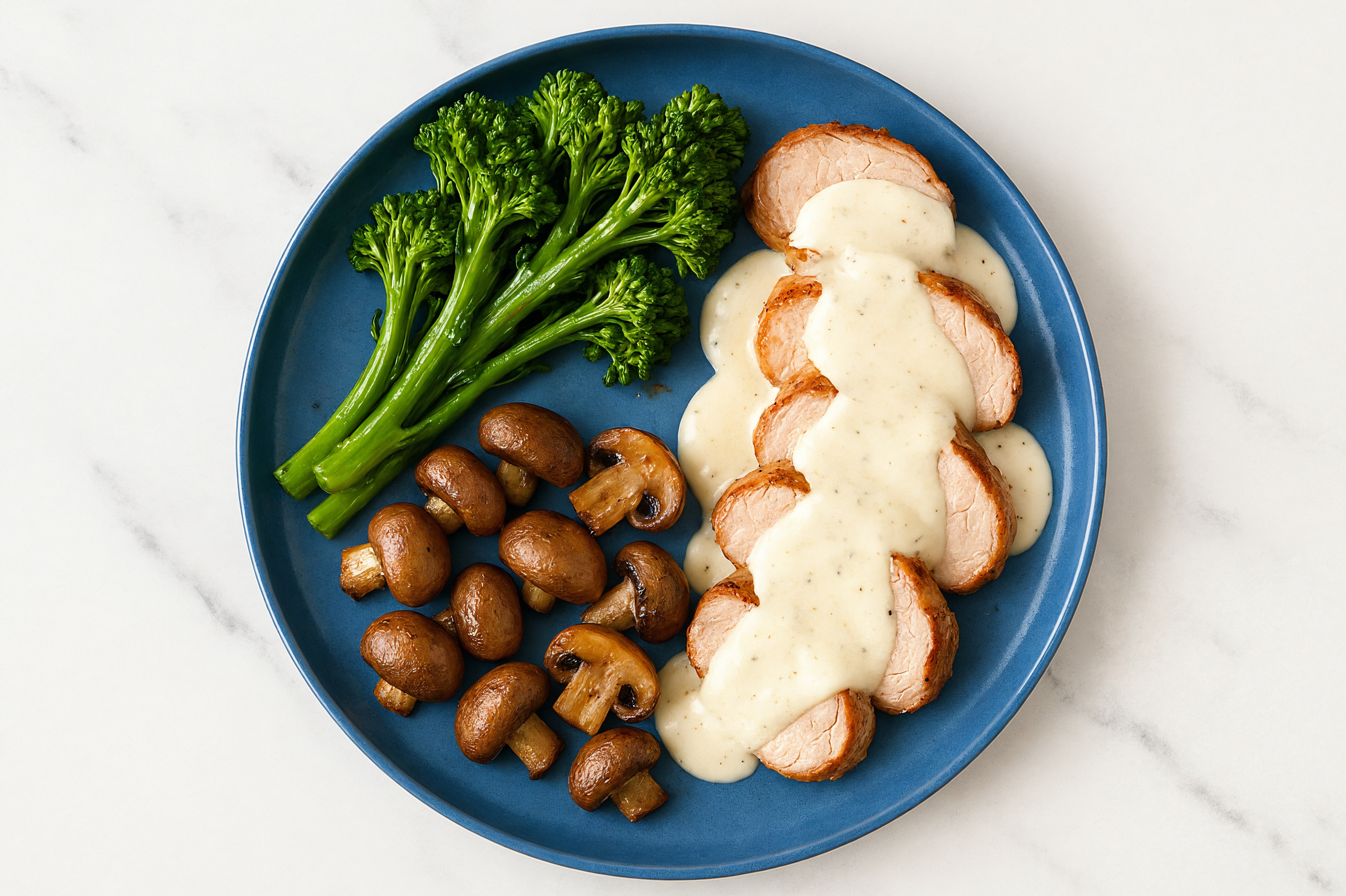 Creamy Parmesan Smothered Pork Tenderloin with Baby Broccoli & Roasted Mushrooms