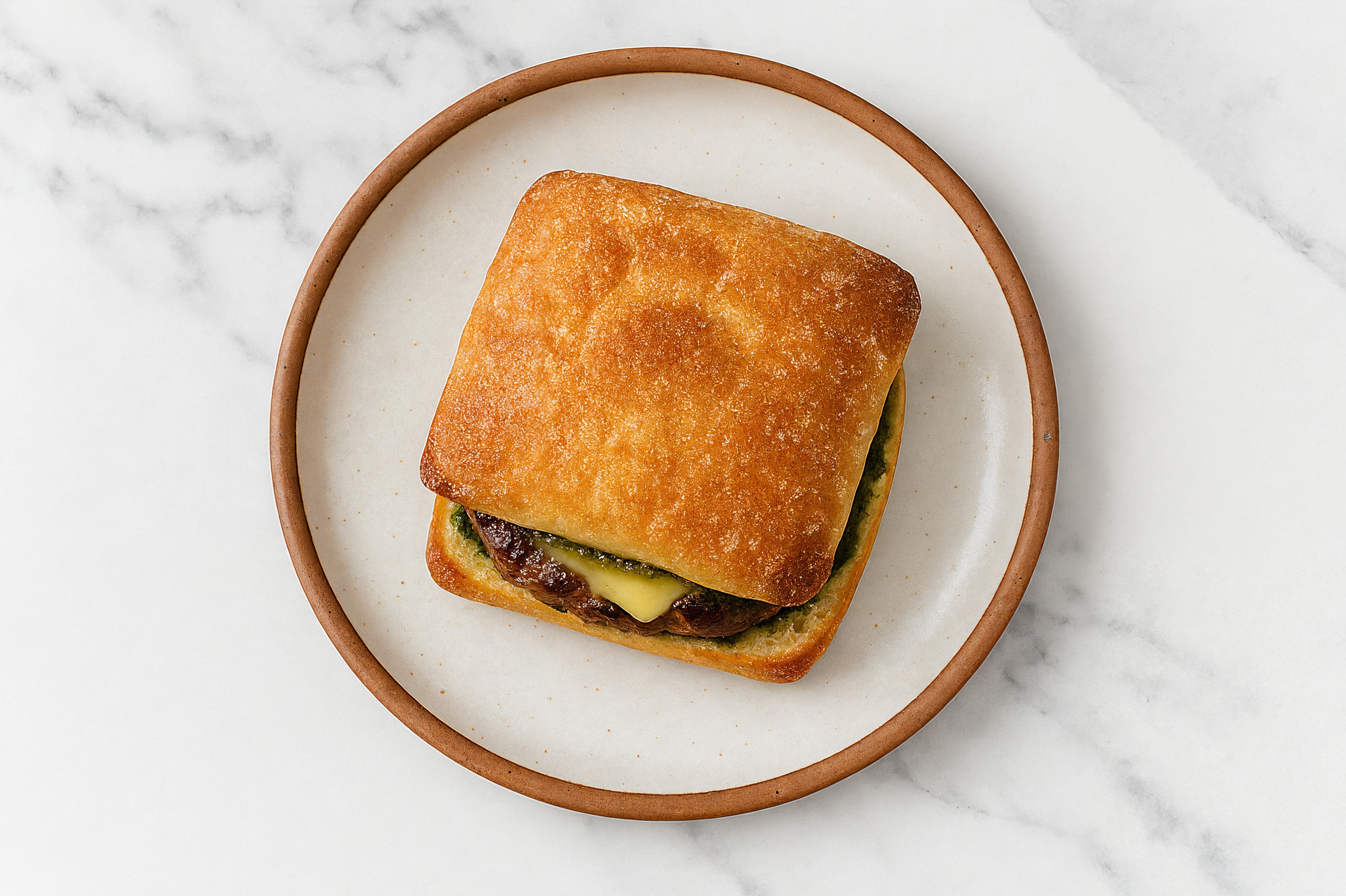 Ground Lamb Burger on Ciabatta with Spinach Pesto & Gouda