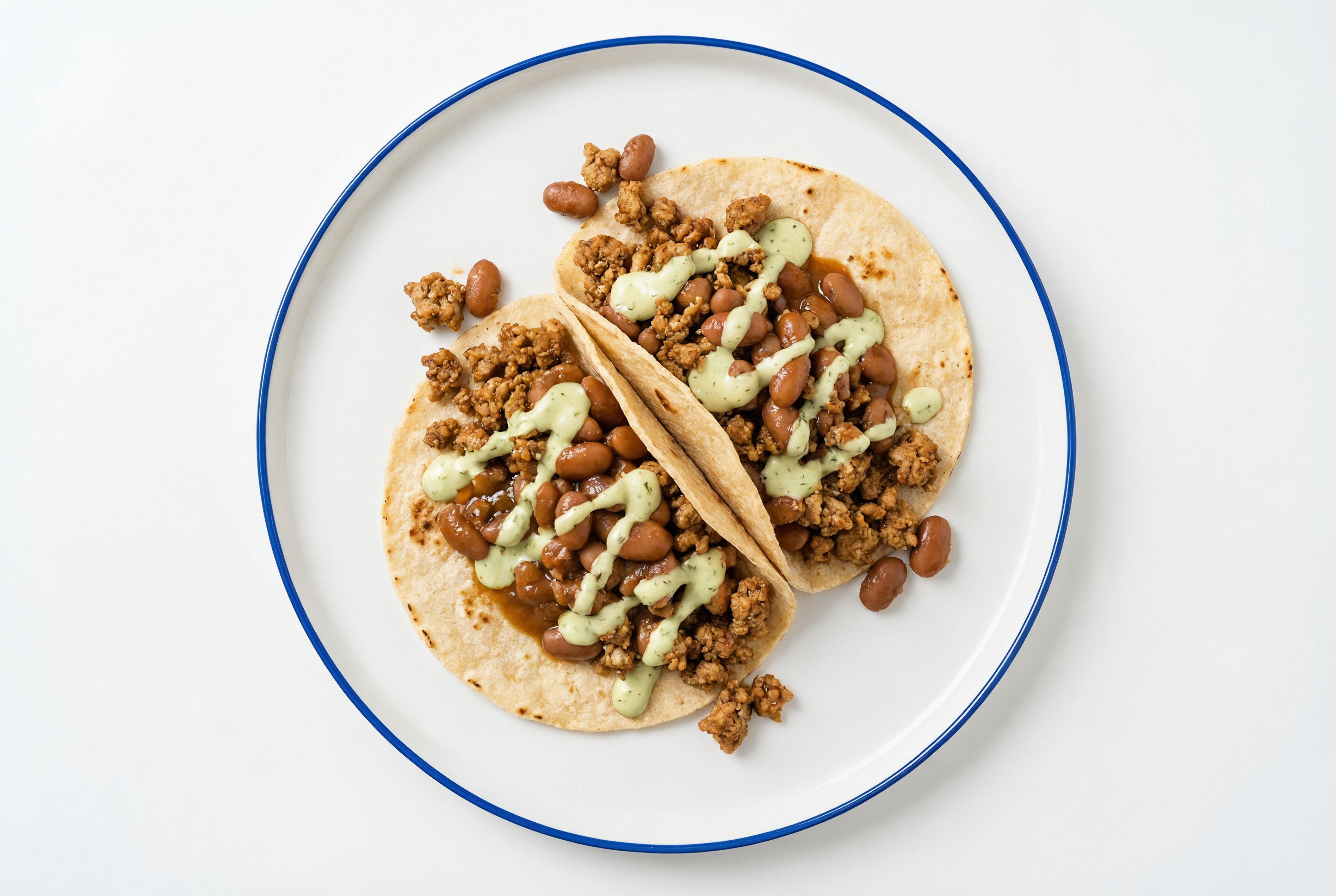 Ground Turkey Tacos with Jalapeño Crema & Pinto Beans