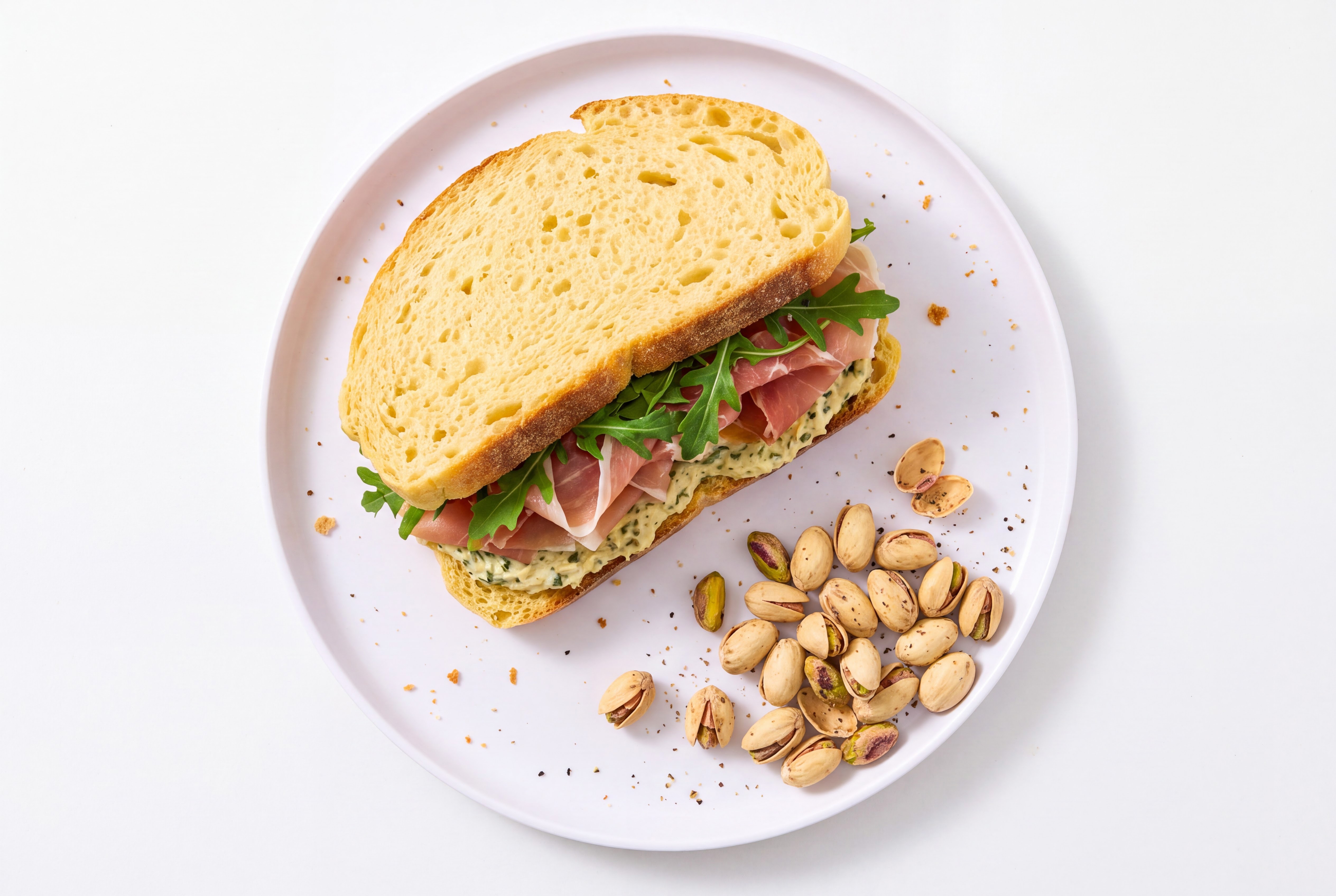 Prosciutto Sourdough Sandwich with Spinach Artichoke + Salt & Pepper Pistachios