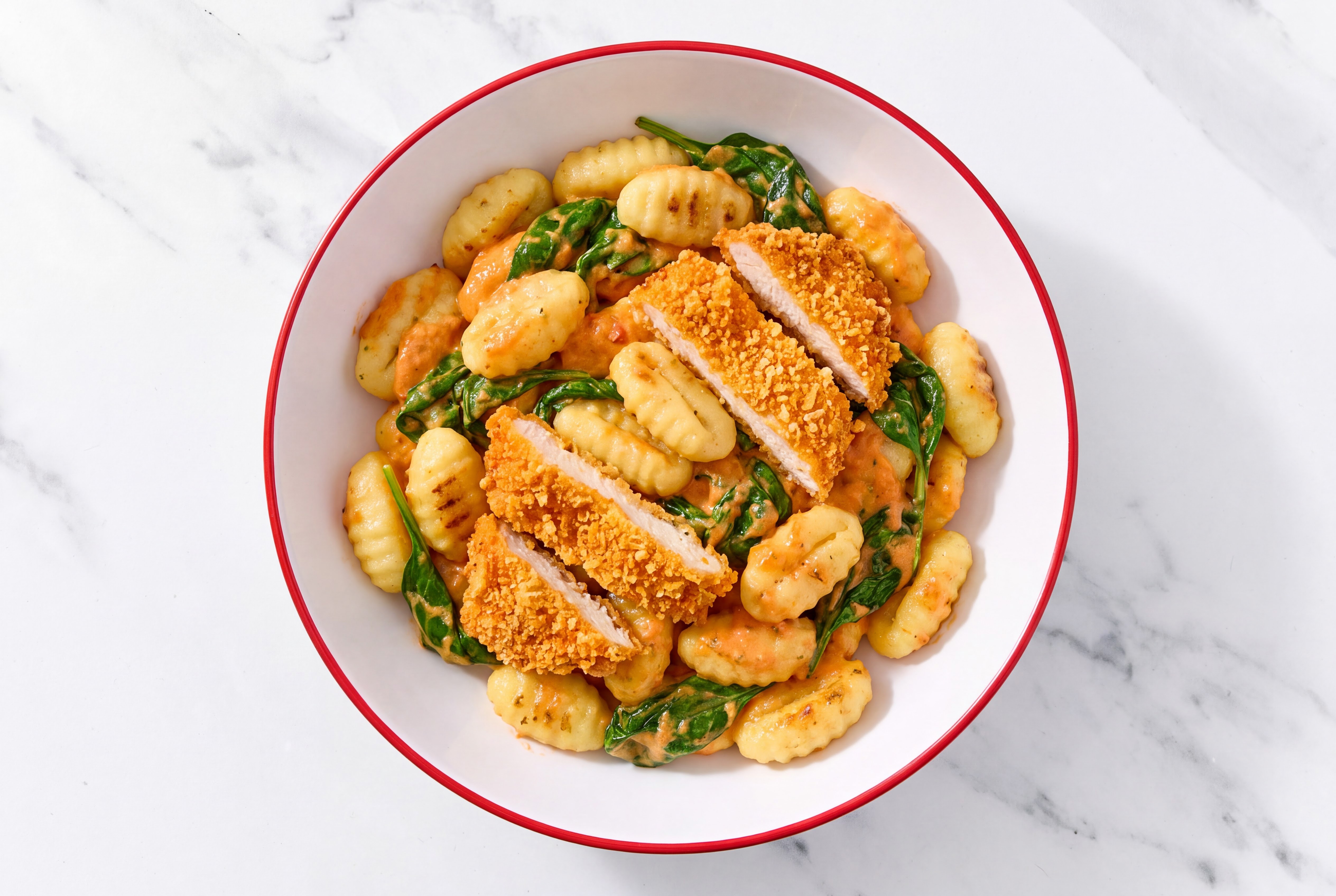 Crispy Hot Honey Chicken over Creamy Vodka Gnocchi with Baby Spinach