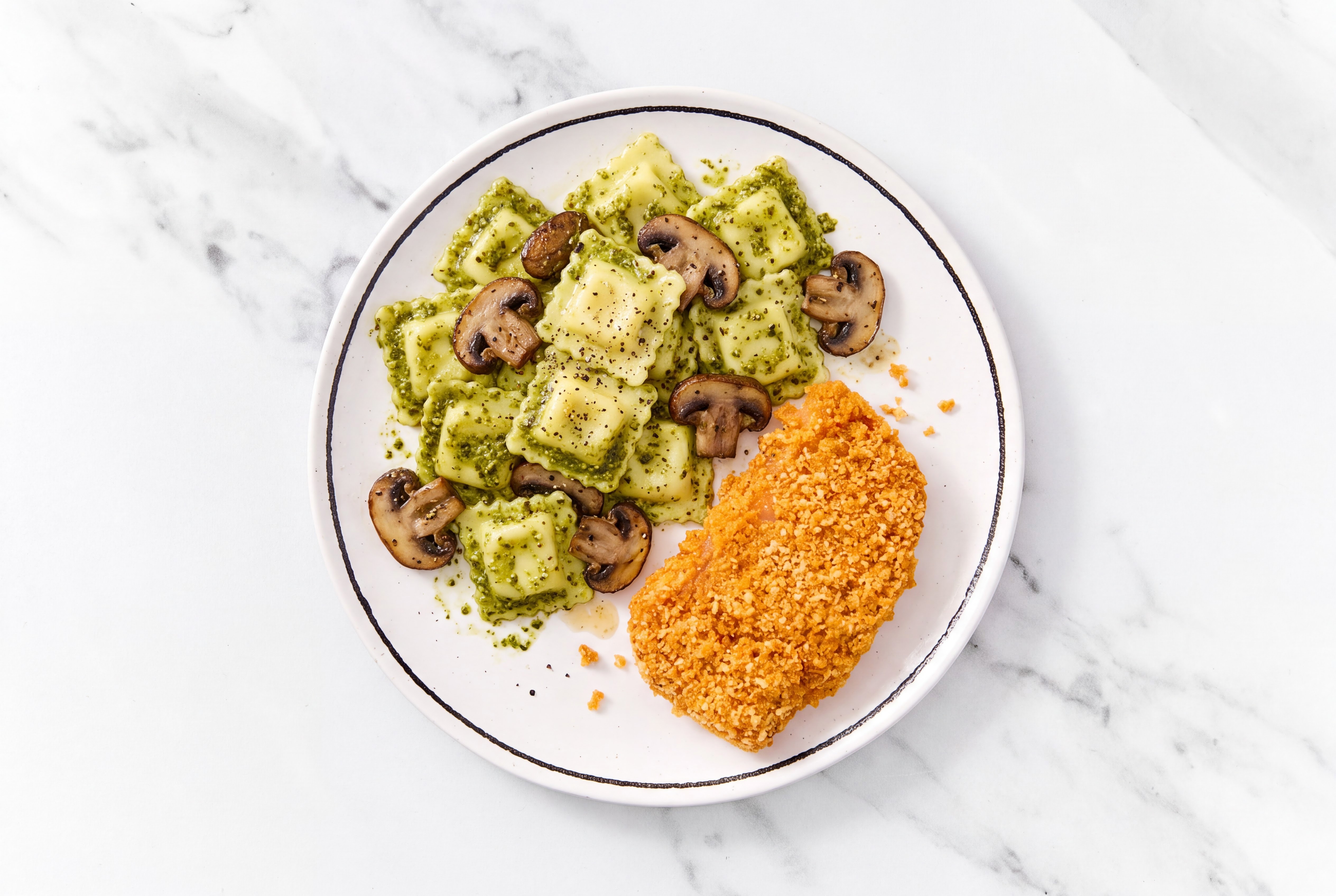 Crispy Hot Honey Chicken over Pesto Ravioli with Baby Bella Mushrooms