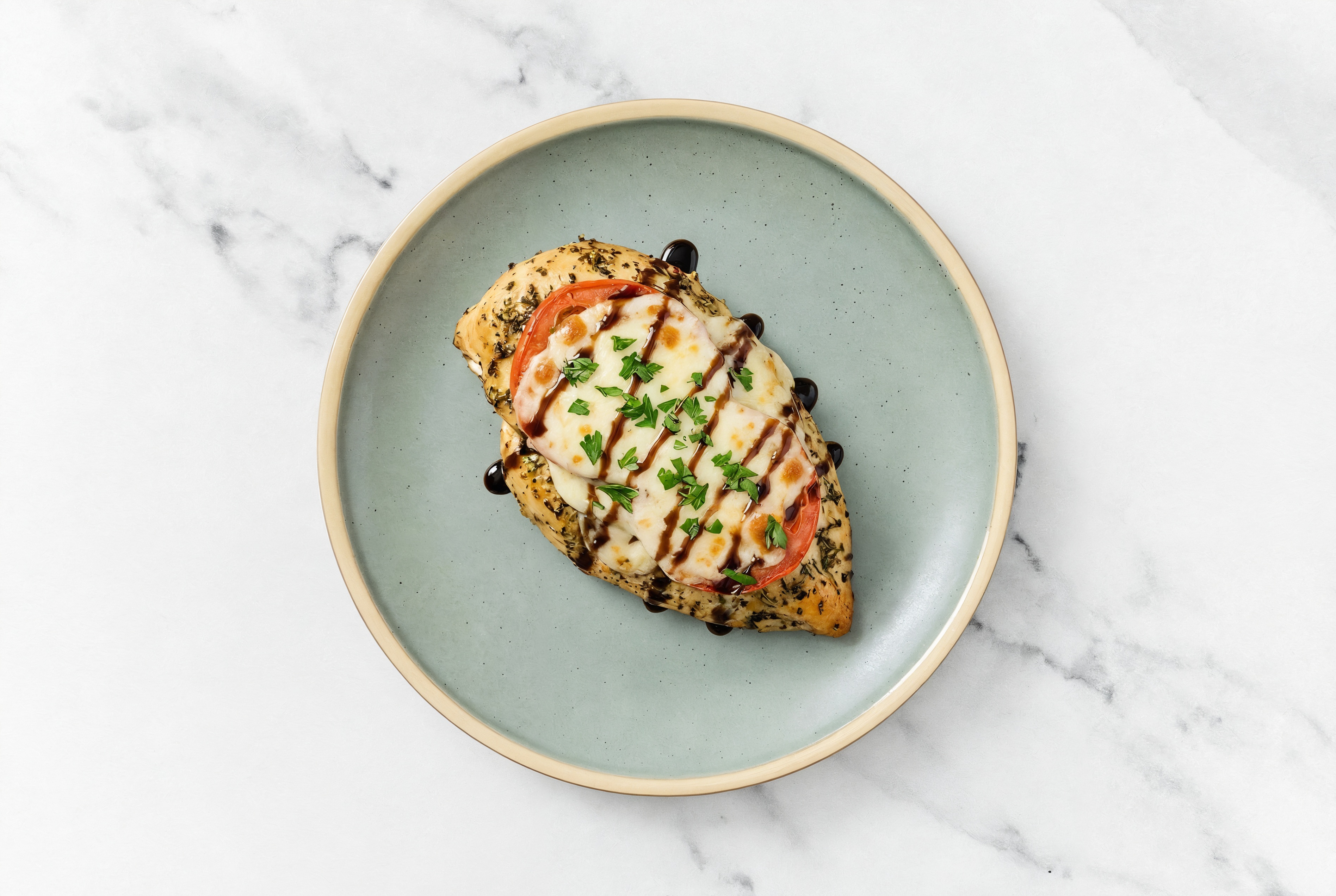 Herby Caprese Baked Chicken Breast with Shredded Mozzarella Cheese