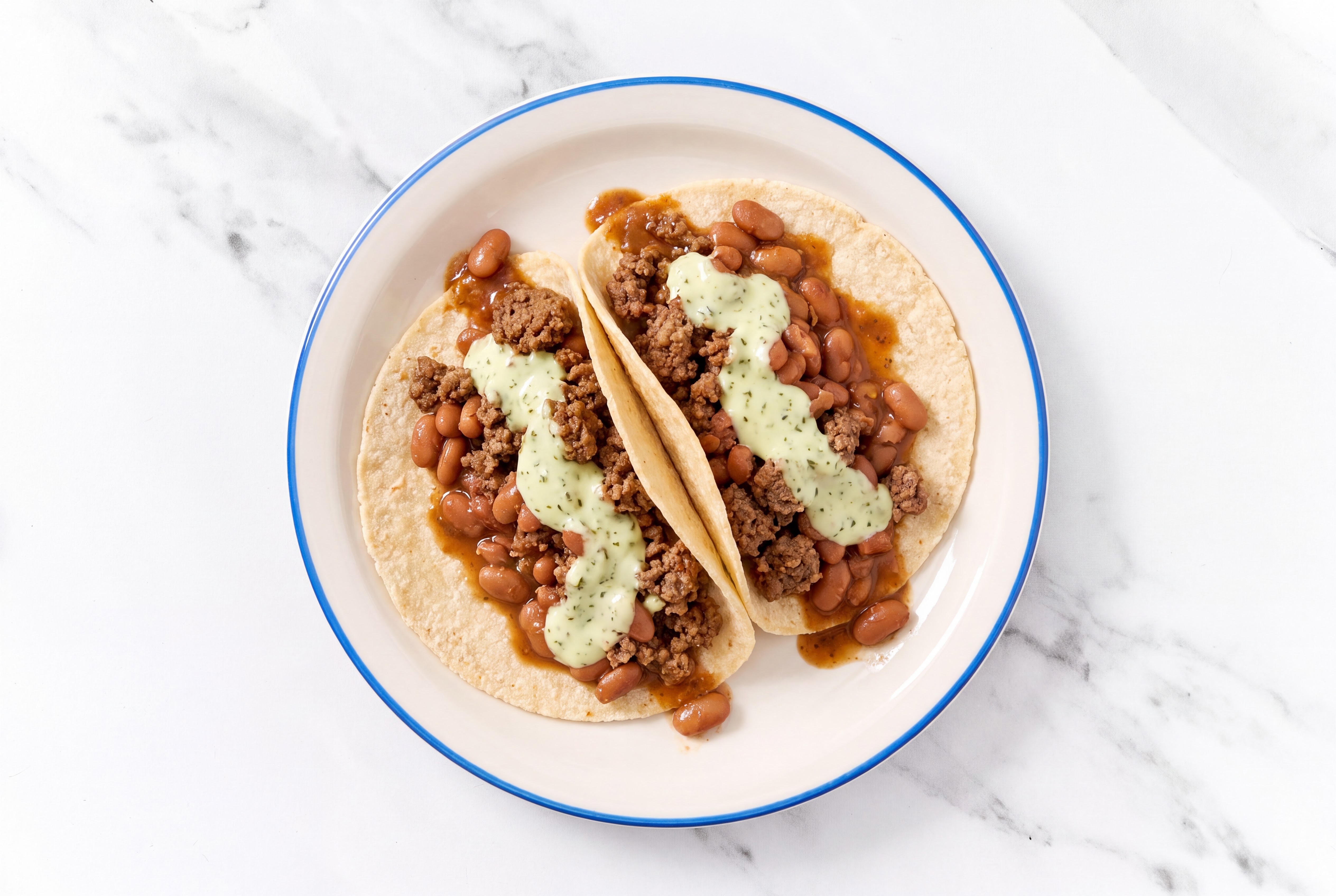 Ground 93/7 Lean Beef Tacos with Jalapeño Crema & Pinto Beans