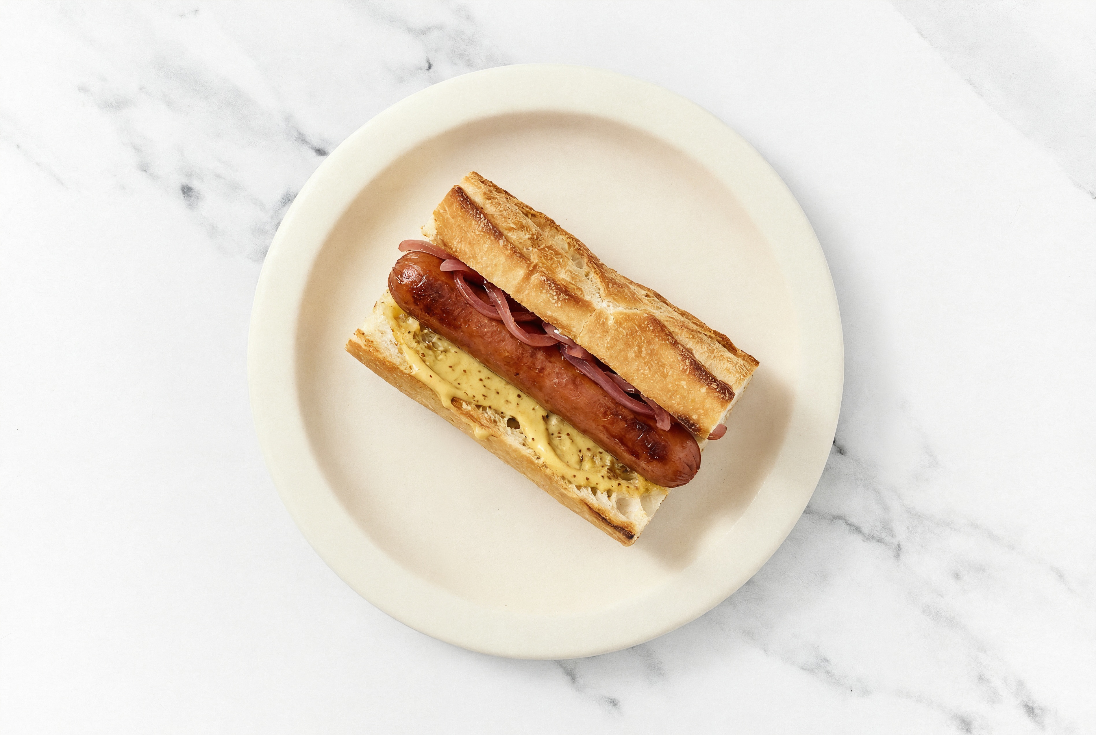 Pickled Red Onion Beef Hot Dog with Honey Mustard on Baguette