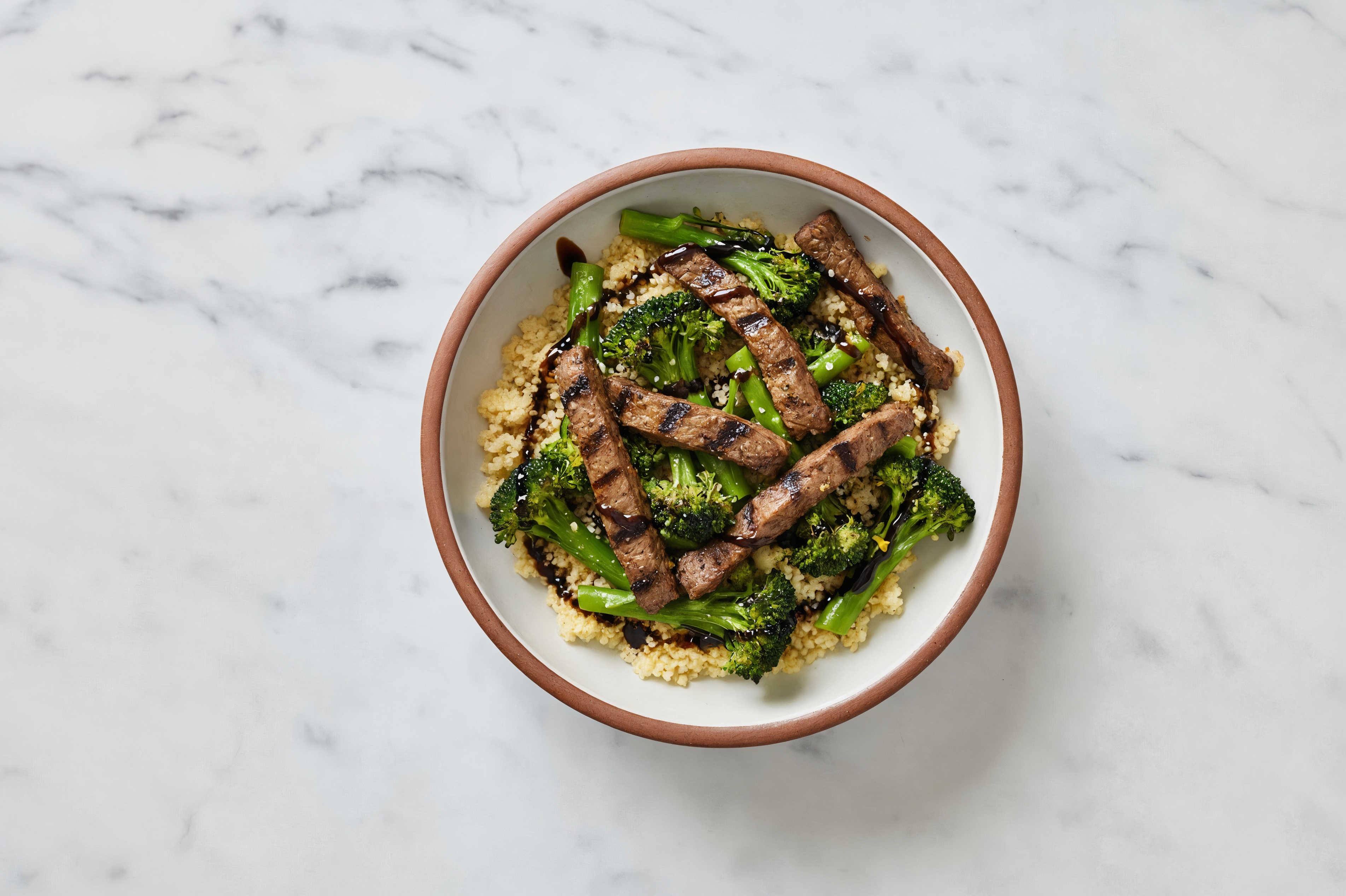 Barbacoa Beef over Couscous with Baby Broccoli