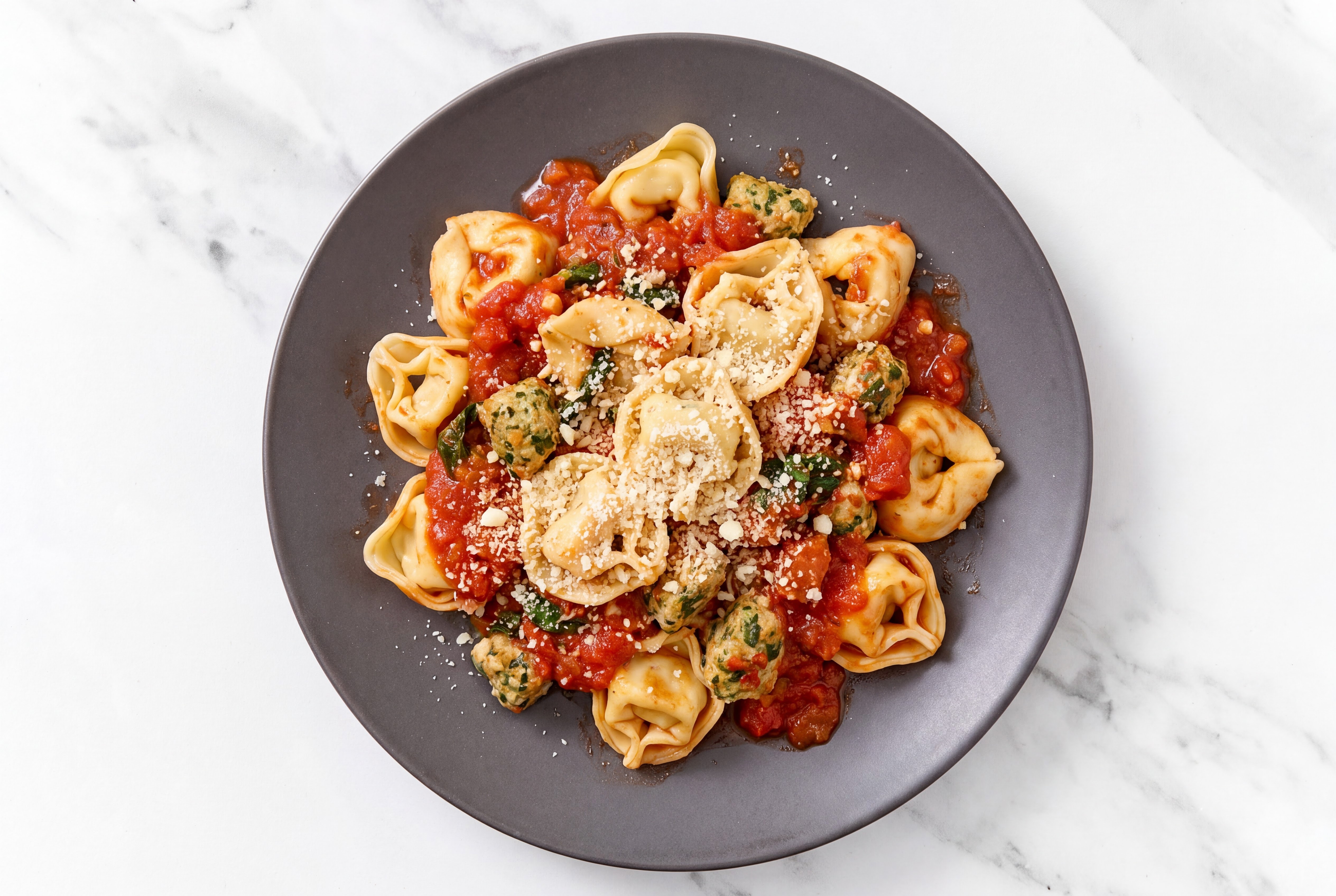 Feta Turkey Marinara Tortelloni with Grated Parmesan Cheese
