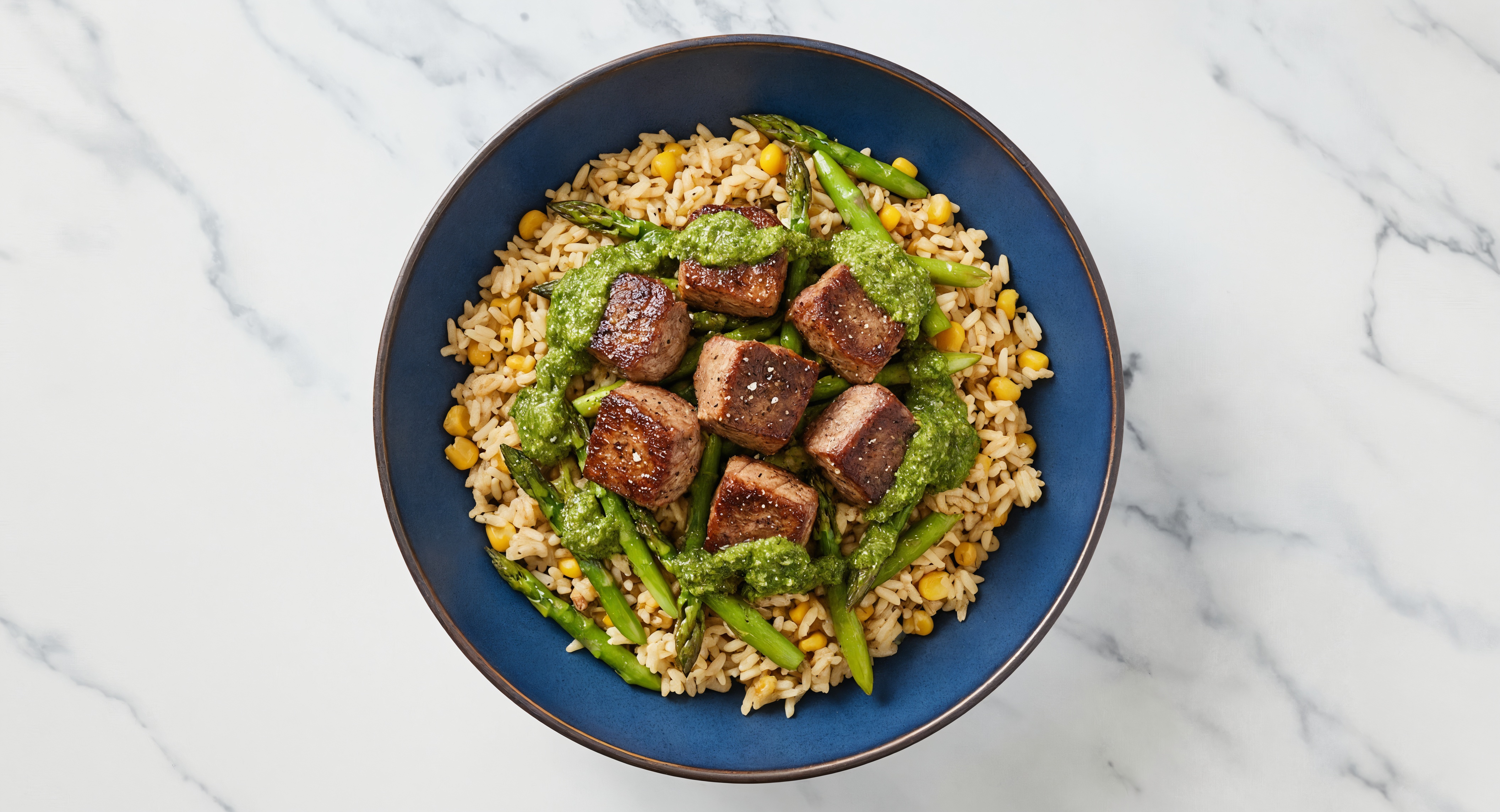 Chimichurri Seared Lamb + Corn Rice Bowl with Baby Asparagus