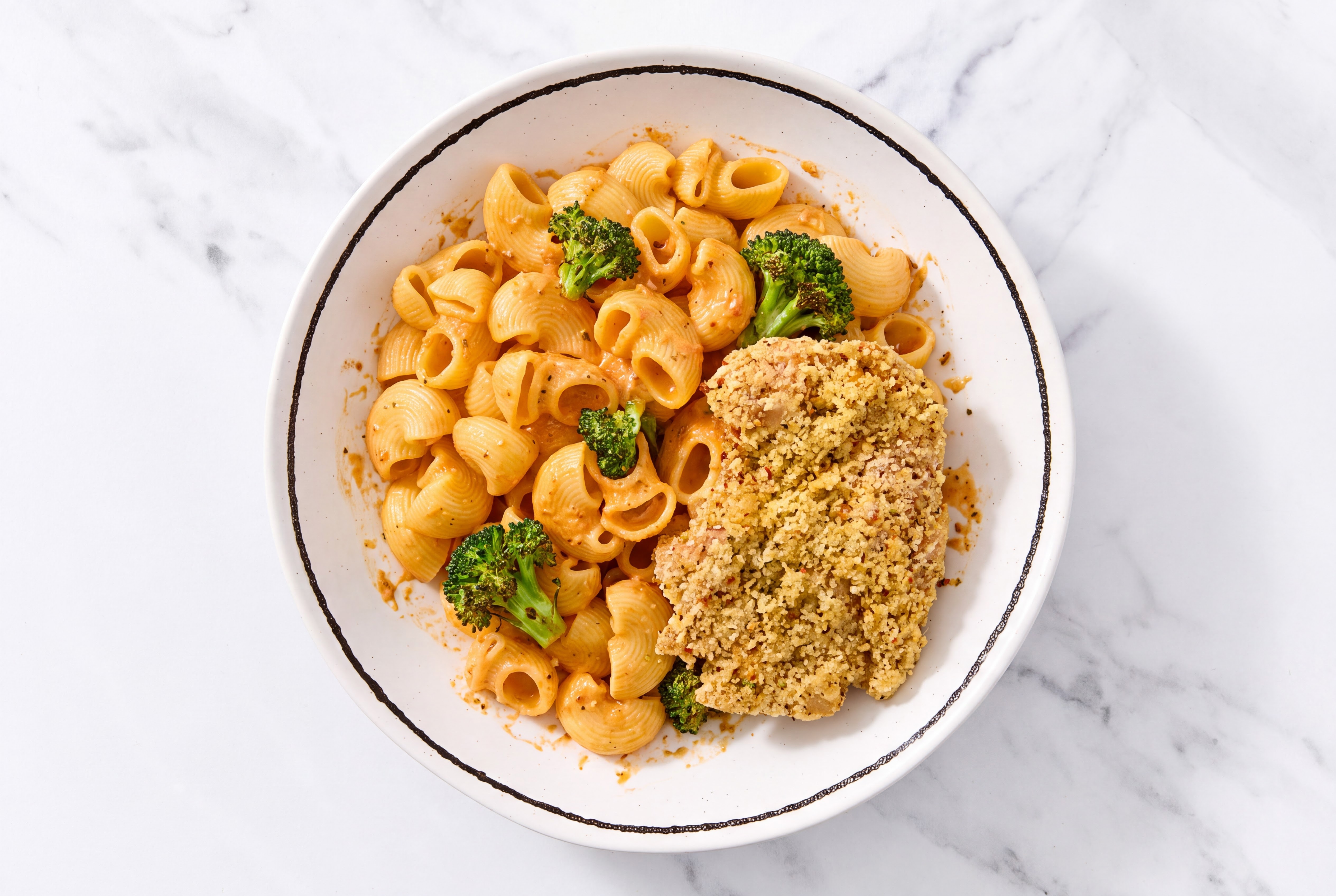Crispy Garlic Chicken over Creamy Vodka Chiocciole Pasta with Broccoli
