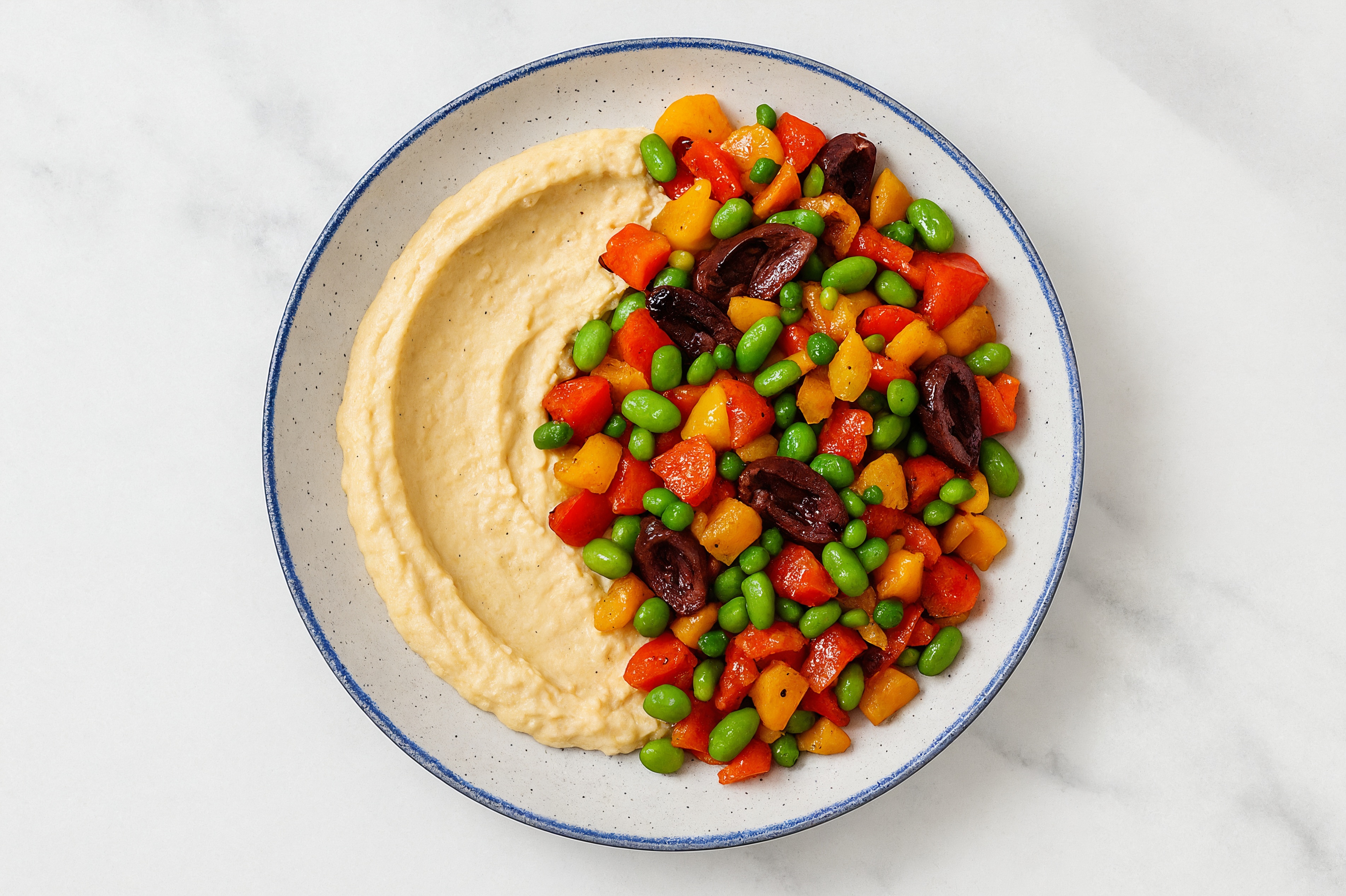 Olive Sweet Pepper Edamame Bowl over Lemon Garlic Hummus