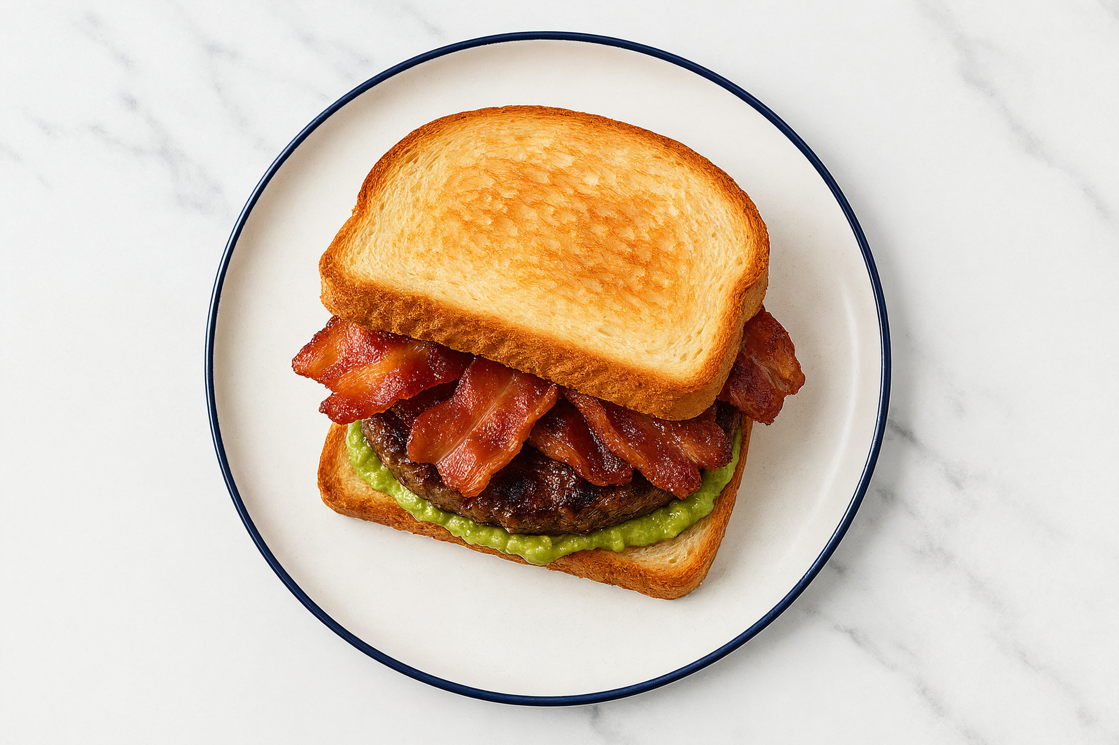 Applewood Smoked Pork Bacon Beef Burger on GF Bread with Guacamole