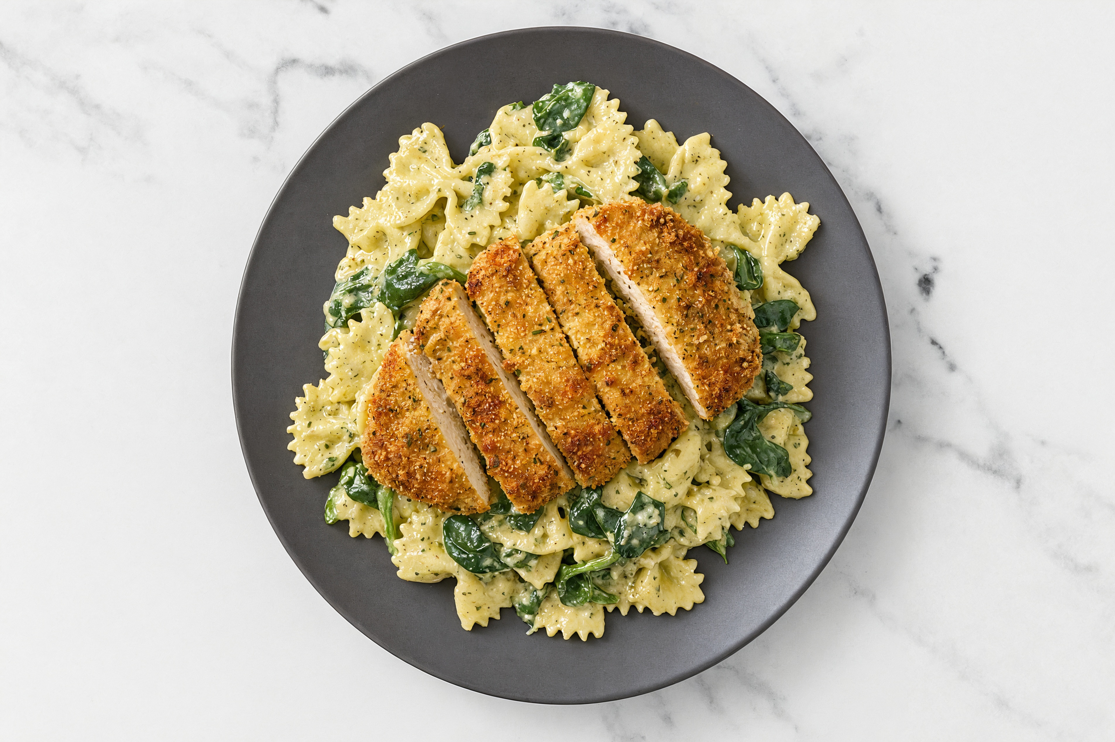 Crispy Garlic Chicken over Creamy Farfalle with Baby Spinach