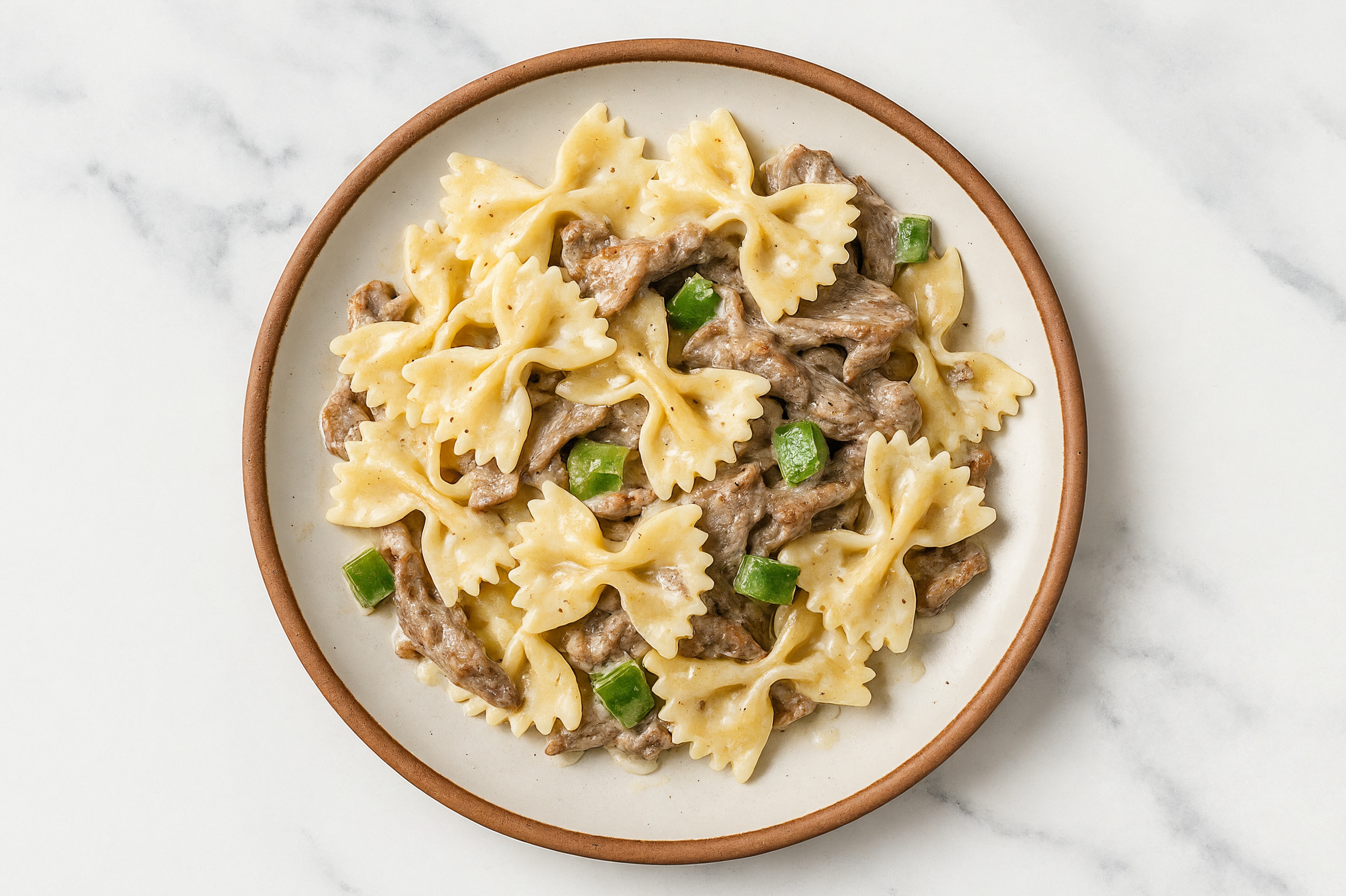 Spicy Shaved Ribeye Cajun Farfalle Pasta