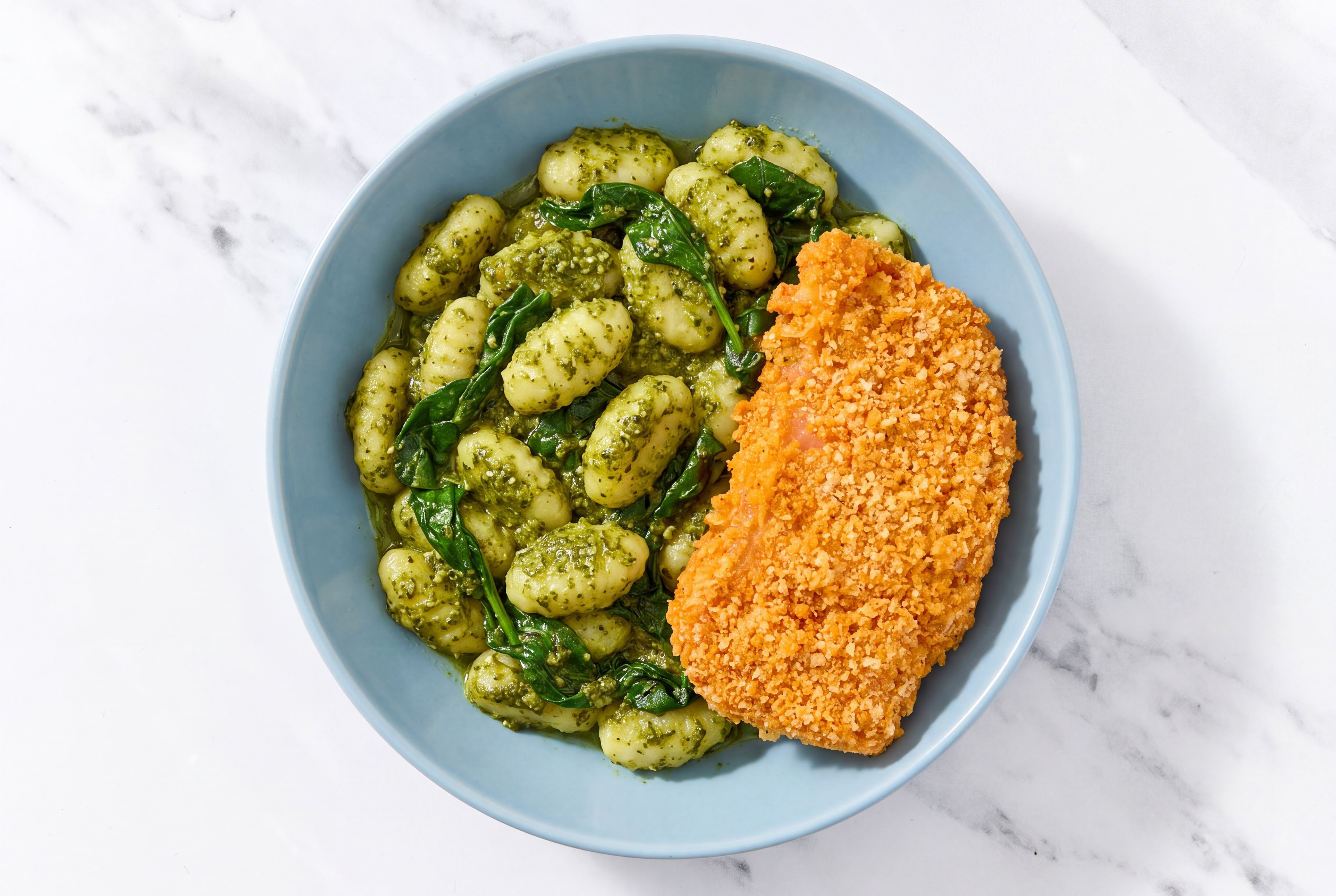 Crispy Hot Honey Chicken over Pesto Gnocchi with Baby Spinach